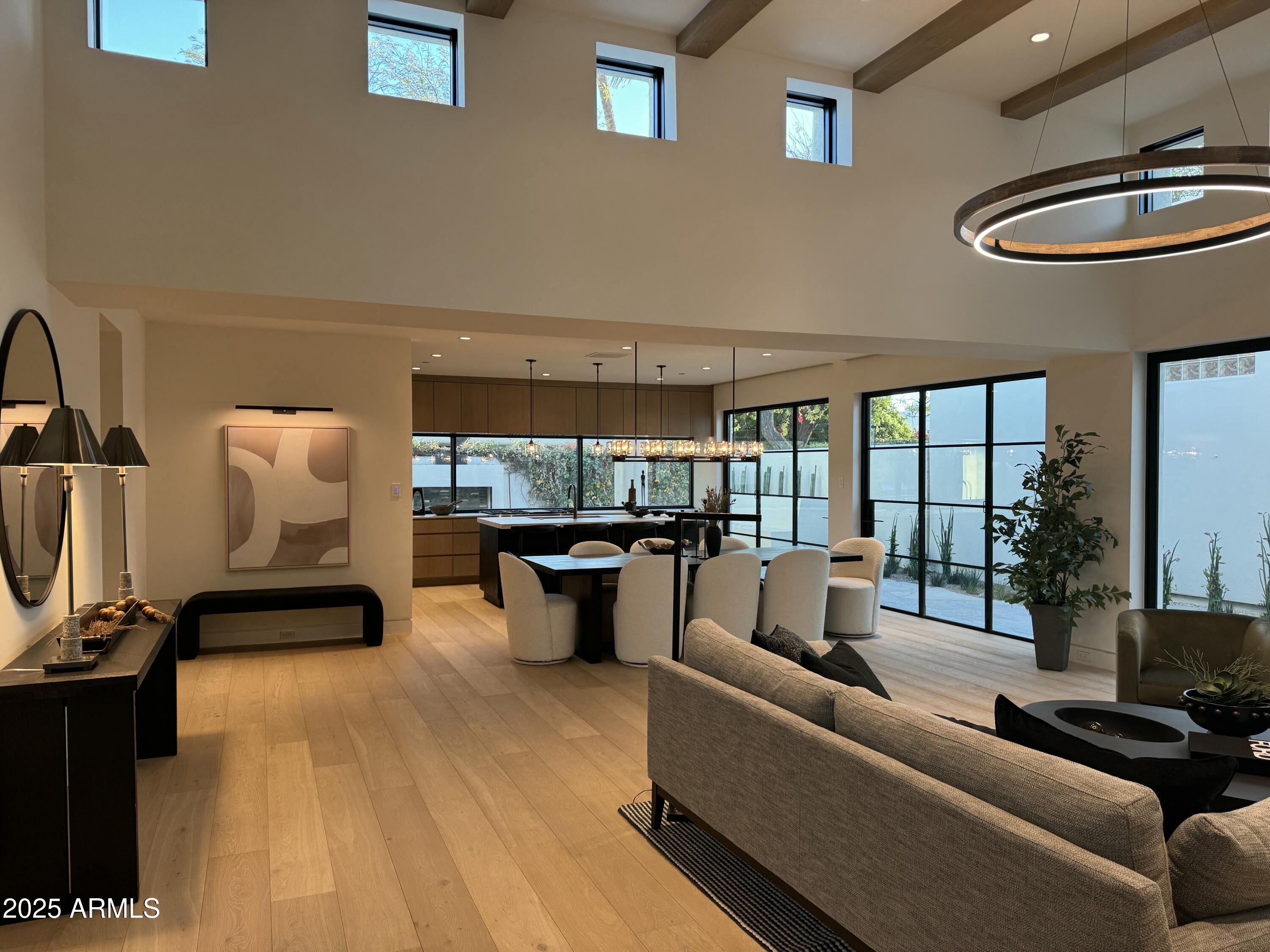 Gorgeous down-to-the-studs remodel in the highly sought after Phase III of Casa Blanca. The open format floor plan with a well-appointed bar space and steel folding doors and pivot doors opening to the wrap-around patio make it perfect for entertaining. The finish level includes European Oak floors, stone counters, custom cabinets, high-end lighting fixtures, venetian plaster accent walls, Subzero/Wolf appliances...and the list goes on. The outdoor space has been thoroughly re-landscaped and includes an outdoor fireplace, gas grill, flagstone, banco seating and a sliding door to the bar. Casa Blanca is a 24/7 guard-gated community on 22 acres at the base of Camelback Mountain. It formally functioned as a resort dating back almost 100 years. Downtown Scottsdale is a short walk away.