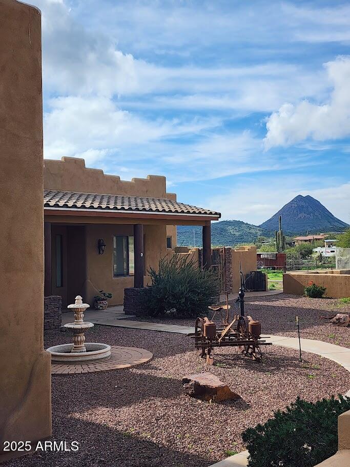 MAKE AN OFFER! 
Modern Luxury Meets Desert Serenity! This stunning New River estate offers the perfect blend of high-tech efficiency and horse-property charm. Peace of mind comes standard with a brand-new roof and a newly installed solar system (fully owned), ensuring massive energy savings. Inside, enjoy pristine water from the new whole-house filtration system. This 5-bedroom custom home features 10-foot ceilings, travertine floors, New wood shutters, and a chef's kitchen with granite countertops and a massive island. Car and outdoor enthusiasts will love the newly enclosed carport, perfect for securing an RV or boat. Step outside to breathtaking 360-degree mountain views and a property that is fully ready for your horses with existing stalls and plenty of room to roam. No HOA, Street not paved