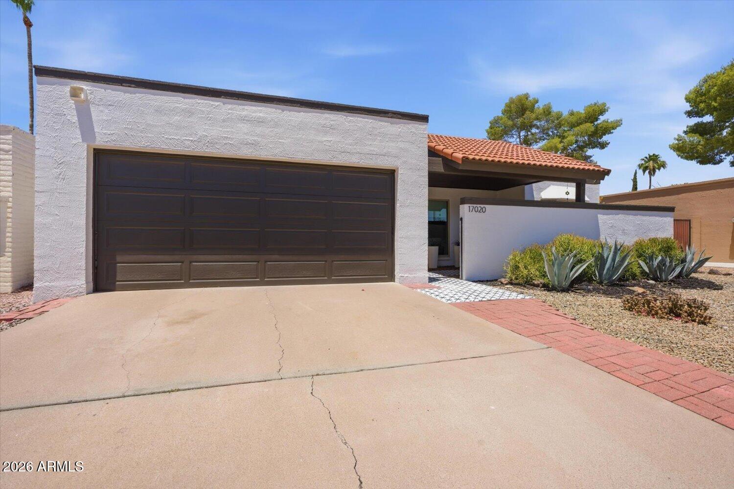 Welcome to easy living in the heart of Fountain Hills. Nestled in a community with a pool just steps from your front door, this thoughtfully updated, move-in-ready, single-level home offers the perfect blend of comfort, style, and low-maintenance living.

A charming private front courtyard creates a warm welcome while adding both privacy and additional outdoor living space. Inside, abundant natural light pours through large windows, creating a bright and inviting atmosphere throughout the home. Tile flooring extends throughout the interior, while the beautifully updated kitchen features granite countertops, stainless steel appliances, an eat-in breakfast bar, and additional floor-to-ceiling pantry storage.

Recent improvements provide peace of mind, including a new roof in 2023, replacement windows in 2018, a tankless water heater, and a water filtration system. The two-car garage features built-in storage cabinets to help keep everyday items neatly organized.

The backyard is designed for enjoying Arizona's beautiful weather year-round, featuring a beautiful, large pergola that creates the perfect setting for morning coffee, an afternoon book, or hosting dinner parties al fresco.

Four Peaks Park is just around the corner, and Fountain Hills' iconic fountain, along with its walking paths, restaurants, shopping, and popular community events, is only a short 3-4 minute drive away.

Combining thoughtful updates, abundant natural light, inviting outdoor spaces, and an exceptional location, this home offers the best of Fountain Hills living.