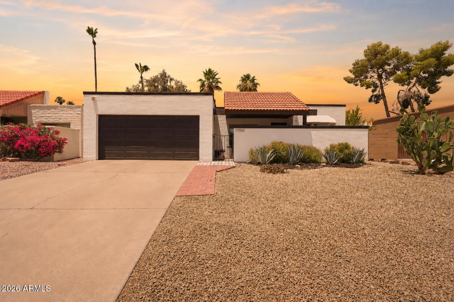 Welcome to easy living in the heart of Fountain Hills. Nestled in a community with a pool just steps from your front door, this thoughtfully updated, move-in-ready, single-level home offers the perfect blend of comfort, style, and low-maintenance living.

A charming private front courtyard creates a warm welcome while adding both privacy and additional outdoor living space. Inside, abundant natural light pours through large windows, creating a bright and inviting atmosphere throughout the home. Tile flooring extends throughout the interior, while the beautifully updated kitchen features granite countertops, stainless steel appliances, an eat-in breakfast bar, and additional floor-to-ceiling pantry storage.

Recent improvements provide peace of mind, including a new roof in 2023, replacement windows in 2018, a tankless water heater, and a water filtration system. The two-car garage features built-in storage cabinets to help keep everyday items neatly organized.

The backyard is designed for enjoying Arizona's beautiful weather year-round, featuring a beautiful, large pergola that creates the perfect setting for morning coffee, an afternoon book, or hosting dinner parties al fresco.

Four Peaks Park is just around the corner, and Fountain Hills' iconic fountain, along with its walking paths, restaurants, shopping, and popular community events, is only a short 3-4 minute drive away.

Combining thoughtful updates, abundant natural light, inviting outdoor spaces, and an exceptional location, this home offers the best of Fountain Hills living.