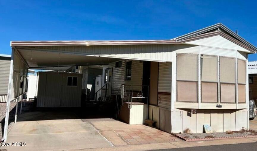 Caliente Casa De Sol, an amenity-filled 55+ community where you OWN YOUR OWN LAND! This fully furnished, and well maintained 1 bedroom, 1 bathroom park model with covered parking is ready and waiting for YOU to come join in on the fun! Heating and cooling system recently updated with remote controlled units in living room & bedroom. Lots of storage inside plus exterior storage shed. Community features a spacious clubhouse complete with a ballroom, kitchen, fitness center, wood working, billiards, and ceramics room, to the multiple swimming pools and hot tubs, shuffleboard, pickle ball, mini golf, horseshoes, dog runs, and SO much more, you'll be so excited to call this place home!