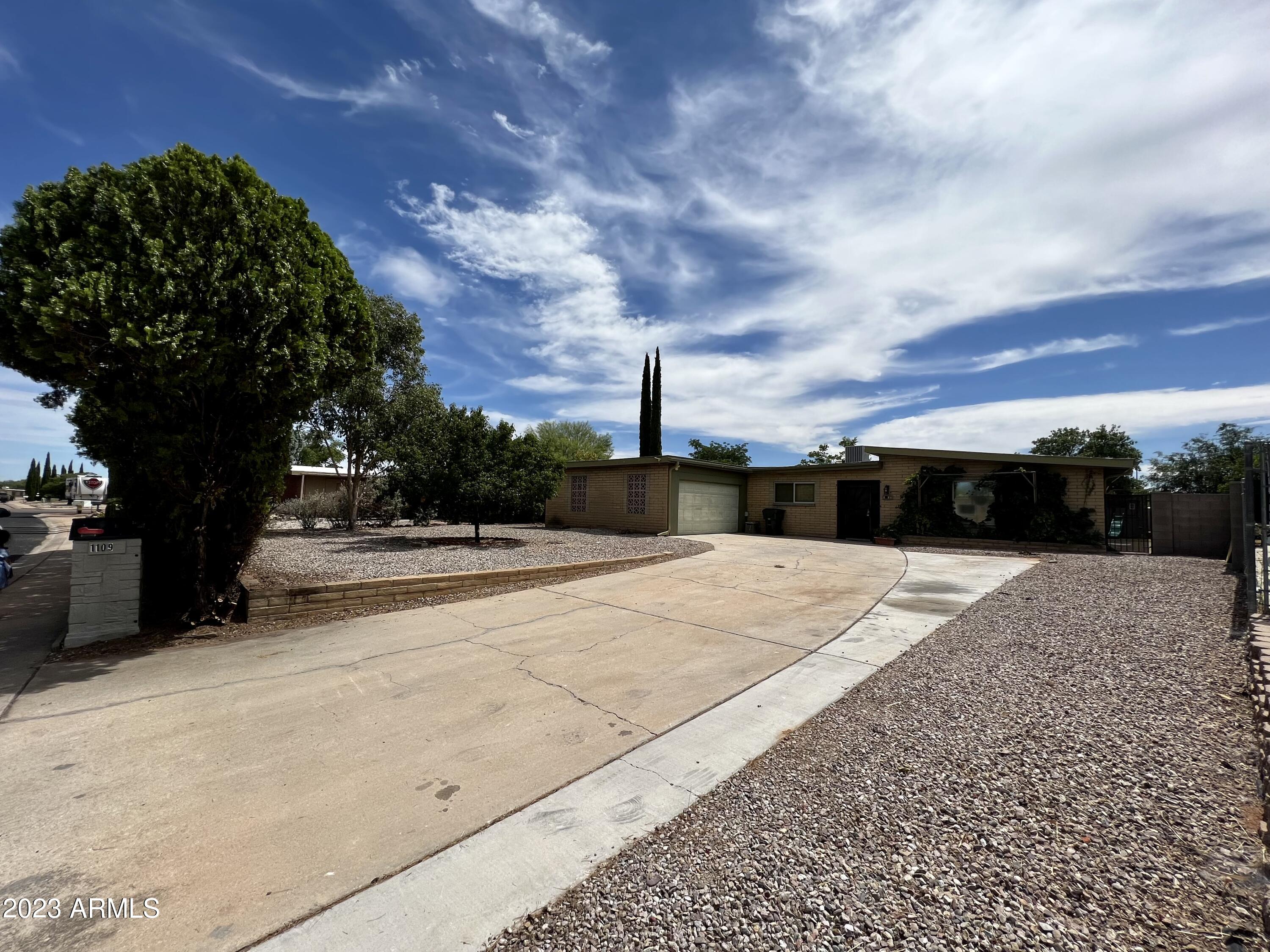 Welcome to your perfect home! This spacious 1,903 sqft abode offers 4 bedrooms, 2 bathrooms, and fresh paint. Gather in the formal dining room or cozy up by the fireplace. Enjoy the tile flooring, large living room, and great room. Outside in the large front yard, you have grapes, a peach tree, and a backyard with an apple tree. Privacy abounds in both yards. Store vehicles and belongings in the 2-car garage and shed. Don't miss this incredible opportunity to call this house your home!
