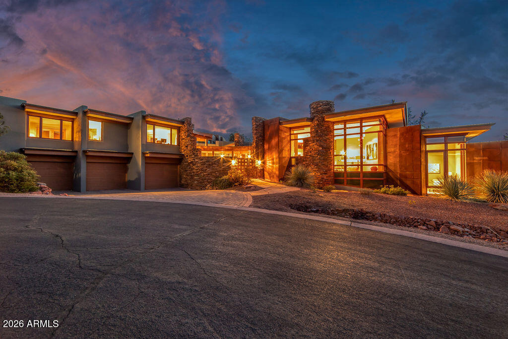 Exclusive luxury in Sedona's premier gated Casa Contenta awaits at 113 Calle Marguerite--a stunning custom home masterfully designed by renowned Design Group Architects, renowned for harmonizing sophisticated architecture with the dramatic red rock landscape. The main residence features 3 spacious bedrooms and 3.5 luxurious bathrooms in an open, flowing layout that captures breathtaking panoramic red rock views from nearly every angle, complemented by a fully separate guest house offering 2 bedrooms and 1 full bathroom ideal for guests, family, or a private retreat. Enjoy a convenient 3-car garage and your personal oasis: a heated lap pool with automatic cover and brand-new equipment for effortless year-round swimming surrounded by iconic scenery. All furnishings and artwork are available.
