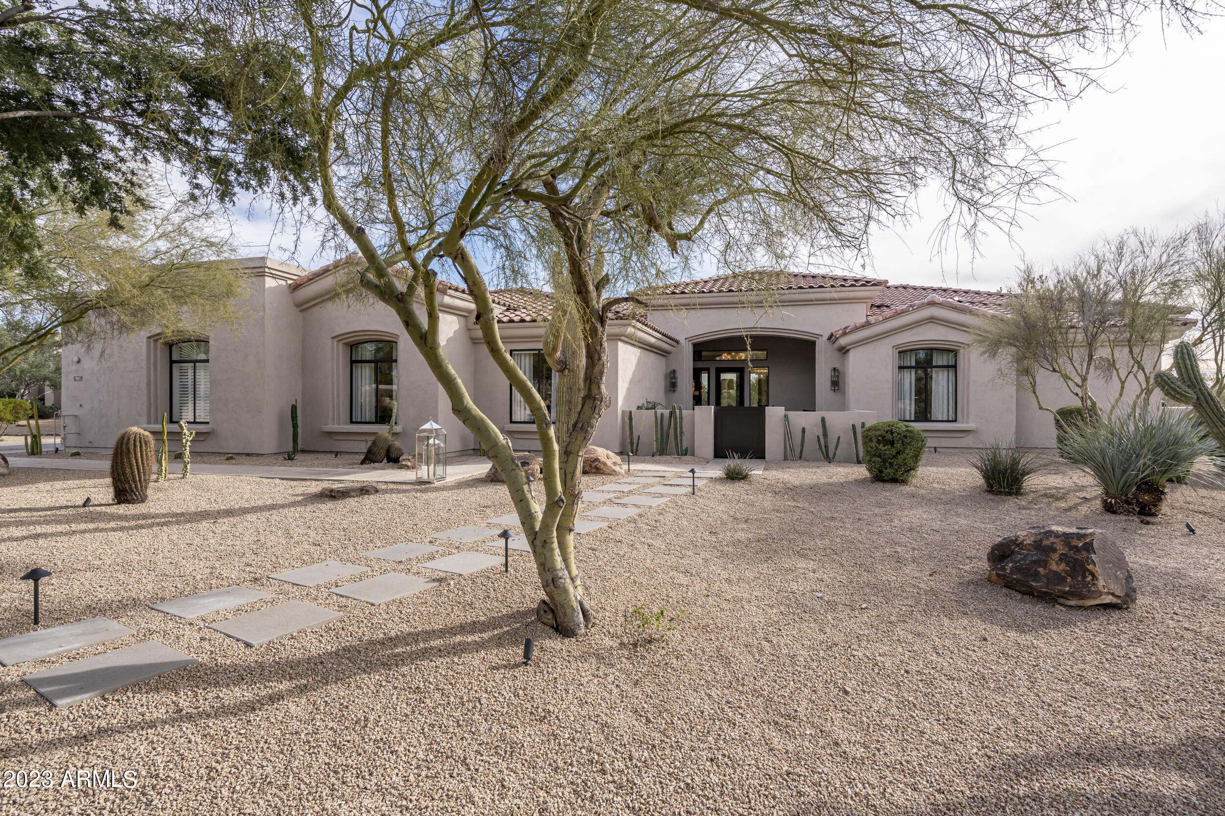 STUNNING LUXURY HOME sitting on 1.2 acres.  Completely remodeled inside and out in 2022, no attention to detail was spared.   Featuring custom millwork throughout, high end lighting and imported stone.  A gourmet kitchen with oversized waterfall island.  Climate controlled wine wall and wet bar.  10 foot glass doors that open up to a sleek backyard with a Ramada, Heated Pool and Spa.
The split floor plan has an oversized primary suite with a fireplace, sitting area, two walk-in closets and a spa inspired bathroom.  The four additional bedrooms are all en suite and, like the rest of the home, remodeled with designer finishings.  
3 car epoxied garage and a roof deck with 360 views.  On a scale from 1-10 this house is a 15!