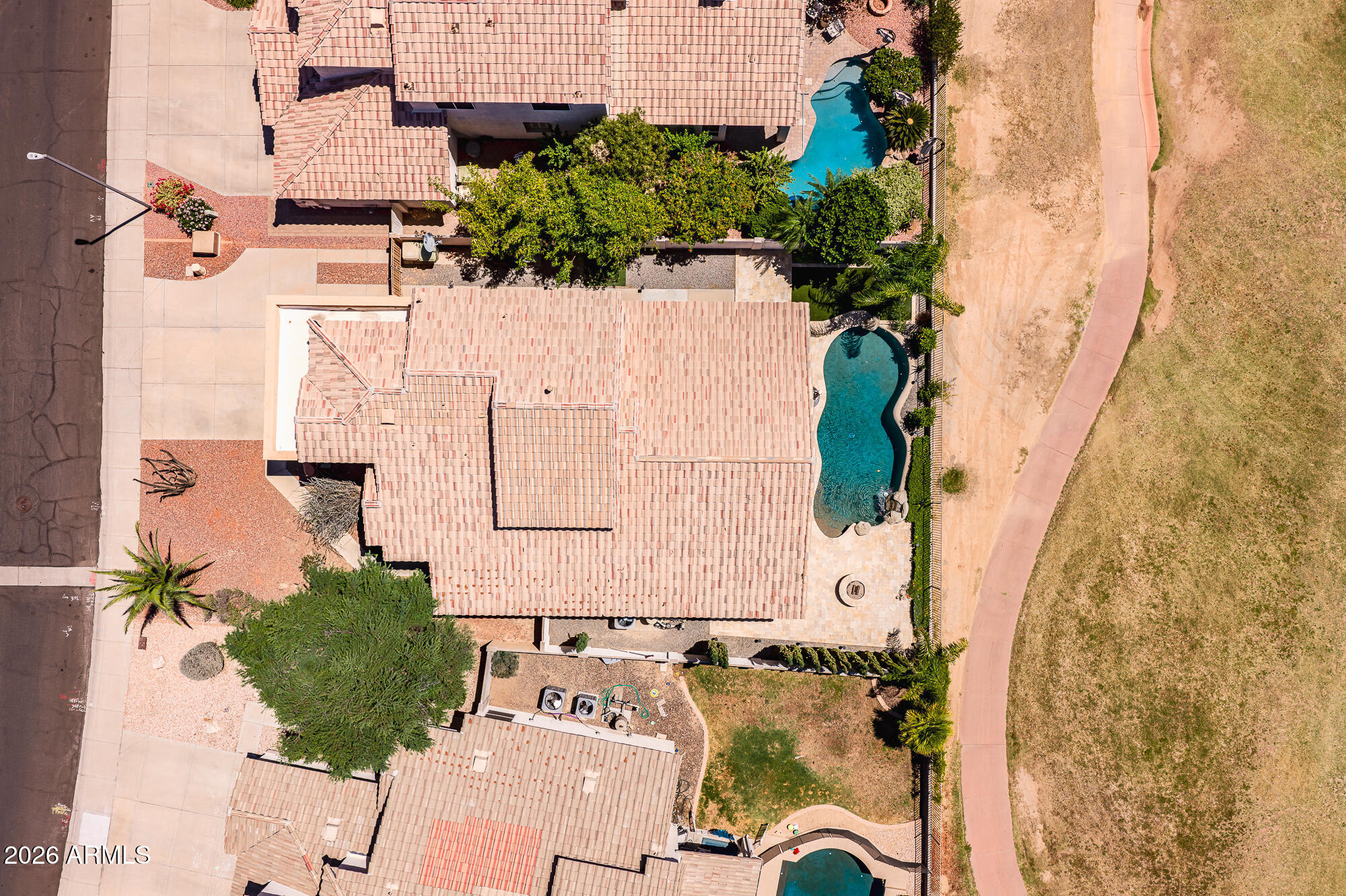 Experience elevated golf course living in this beautifully updated home overlooking the The Clubs at Arrowhead - Legends Course with stunning views and a resort-style backyard. Enjoy a remodeled outdoor oasis featuring new Noce travertine, Pebble Tec pool, stone fire pit, artificial turf, updated landscaping, retractable sunshade, and spacious side yard. Inside, you'll find newer interior paint, updated flooring and baseboards, stainless steel appliances, and a stylishly updated half bath. The flexible floorplan offers a downstairs primary suite plus loft and 2 bedrooms upstairs. Major improvements include a newer roof, new water heater, Bryant A/C, upgraded foundation reinforcement system, and moisture mitigation for added peace of mind. Move-in ready with thoughtful upgrades throughout!