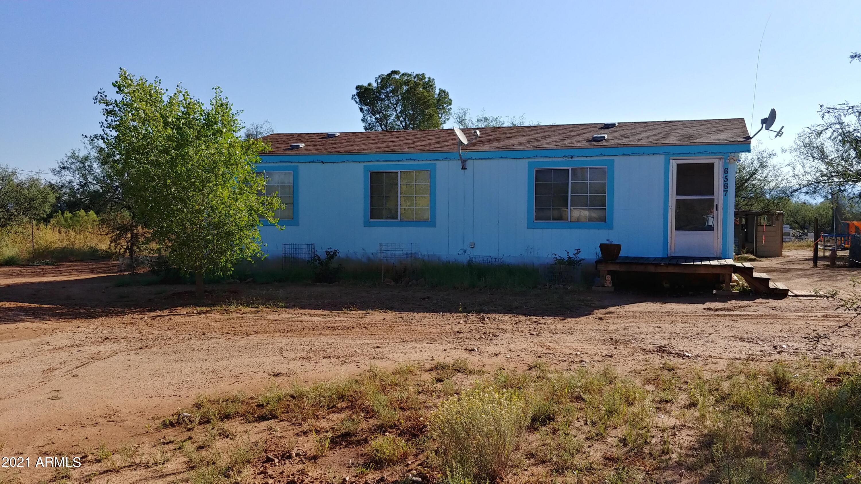 DO NOT DISTURB OCCUPANTS! This home is priced to sell right now! Cash offers only and must close by 10/26/2021. Here is a wonderful opportunity to purchase a great investment. The home has 2 good sized bedrooms and 2 baths. It has a good floor pan and would be a great rental property. There is a barn that is currently used for cars and storage. 3 exterior stalls on the barn. 48 hour written notice is required for any showings. NO SIGN!