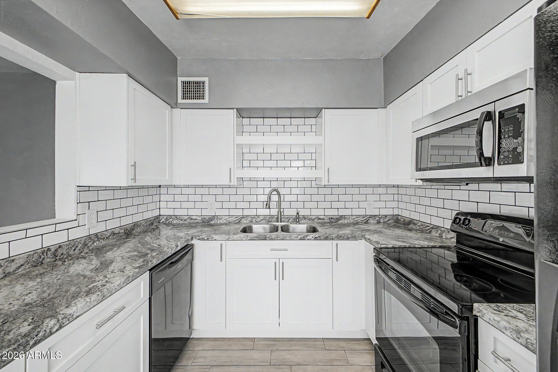 This 1960-built single-family home delivers more than its square footage suggests. The floor plan opens up with a generous 20x16 living room that connects to a fully renovated kitchen featuring white shaker cabinets, stone appearing countertops, a white subway tile backsplash, and nice appliances, including a dishwasher. Plus a brand new AC to help keep you comfortable. A bonus room measuring over 250 square feet adds the kind of flexible space most homes in this price range simply do not offer. Use it as a family room, home office, gym, or fourth sleeping area. Three bedrooms include the primary with its own closet, and all bedrooms feature ceiling fans and mirrored closet doors. The updated bathroom offers a new vanity with a solid surface top. A separate laundry room keeps daily function out of the living space. Wood-look porcelain tile runs through the main areas of the home. A brand new foam roof installed in 2026 means the big-ticket item is already handled. Out back, a fully block-walled yard provides privacy and room to work with, plus a storage shed included with the property. No HOA, low taxes, and a large 8,106 square foot lot. Homes with this combination of updates, bonus space, and no HOA at this price point do not sit long.