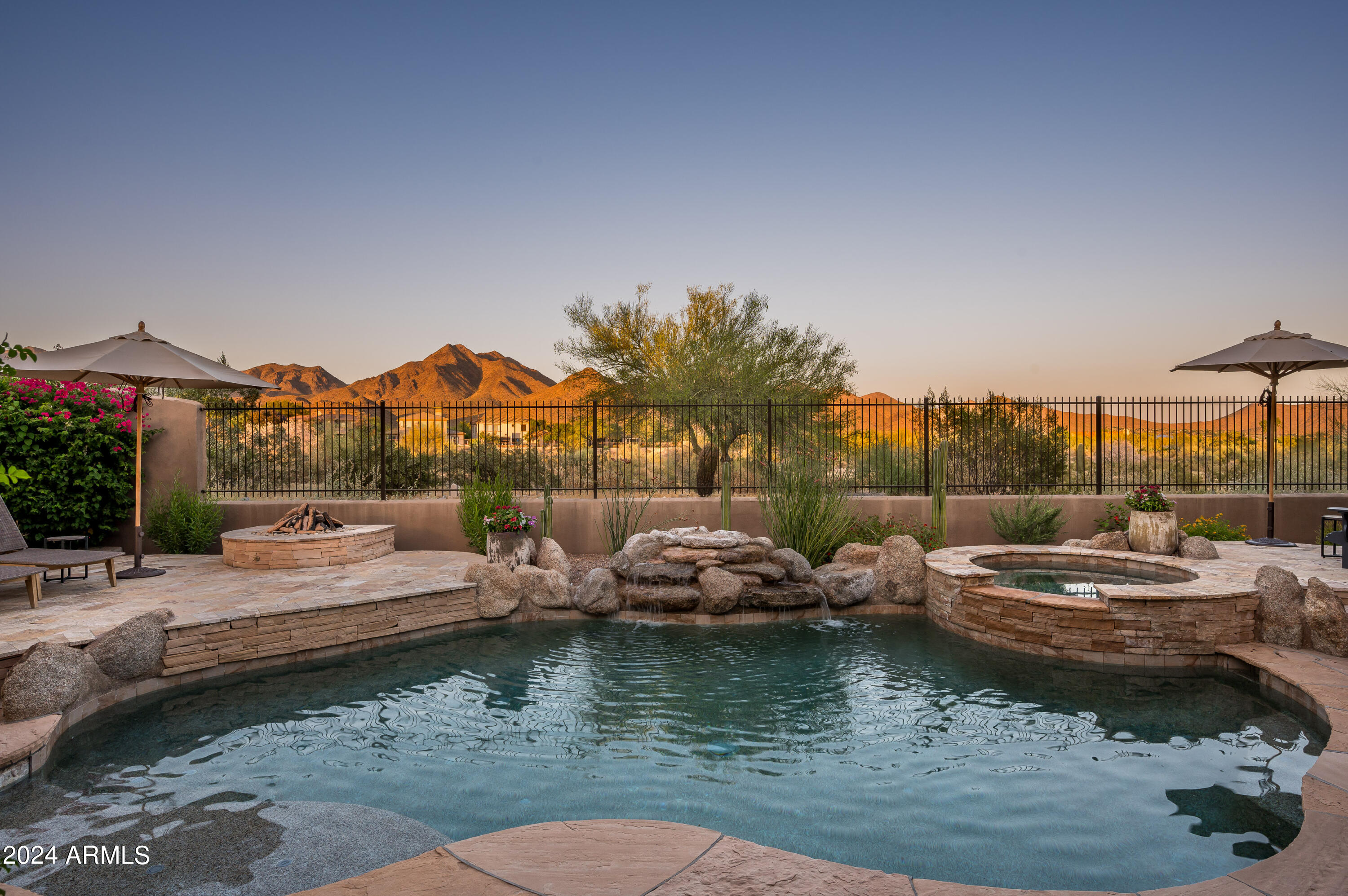 Unobstructed views of McDowell Mountain await at this newly remodeled, single-level DC Ranch home, perfectly situated at the end of a cul-de-sac in the gated Desert Haciendas neighborhood. This stunning Spanish Modern residence features 4 bedrooms plus a den, 3 ½ bathrooms, and underwent a COMPLETE interior renovation in 2023-2024. Upgrades include brand new wood flooring throughout, wood ceiling details, Sub-Zero and Wolf kitchen appliances and new cabinetry, remodeled bathrooms with updated cabinets, countertops, and fixtures, a new fireplace, and a coffee bar. The spacious primary bedroom boasts coffered ceilings, newly renovated closets, a large walk-in shower, and a separate soaking tub.