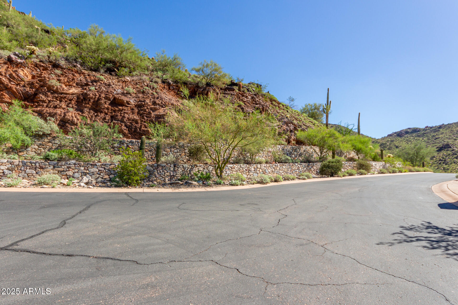 Outstanding 2.97-acre view lot in the prestigious Summit at Silverleaf. Elevated at over 2,600 feet, this homesite offers a generous 28,439 sq ft building envelope and panoramic views of the McDowell Mountains, city lights, and lush desert landscape. Enjoy ultimate privacy and stunning sunsets from this premium location perched above the Silverleaf golf course. Unique natural features like ancient rock outcroppings enhance the setting, creating the ideal canvas for a custom luxury estate. One of the finest remaining lots in Silverleaf, offering unobstructed vistas and the serenity of the high Sonoran Desert. Design your dream home in a community known for exclusivity, elegance, and breathtaking surroundings