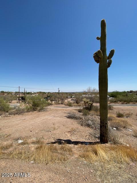 PANORAMIC VIEWS! Enjoy the views overlooking the Apache Junction area on an approx. 1.99 acre lot that is tucked back into a small canyon at the base of the Goldfields. And just wait until you see the night time views! Mature saguaros on the property, as well as many other forms of desert vegetation. This lot is partially leveled and ready for a custom build or manufactured home. BONUS! Water, power, and septic are already hooked up. Zoning is General Rural allowing for a number of uses  including as a horse property. Come take a look for yourself! The views won't cost a thing!
