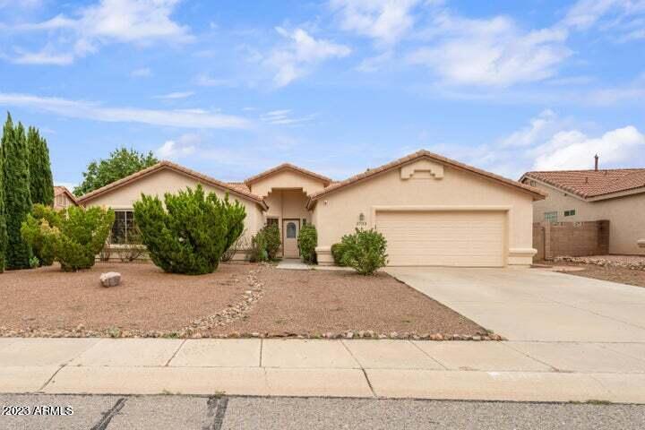 This fantastic 4BR/2.5BA/2CG, 2179 sq.ft. house in the Canyon De Flores subdivision is centrally located in Sierra Vista, AZ minutes from Ft. Huachuca, shopping, Huachuca Mountain Elementary and Canyon Vista Medical Center. The Interior has space for your needs with 2 living spaces and a large open kitchen equipped with an island and stainless appliances. Half bathroom is located centrally to living spaces and kitchen making this ideal for entertaining and gatherings. Fireplace in main living room. Primary bedroom has en suite that allows for you to escape in the soaker tub, shower stall is separate and there are 2 sink vanity. Outside space is not limited on this property with a covered patio and different areas to help you enjoy your backyard. Call today.