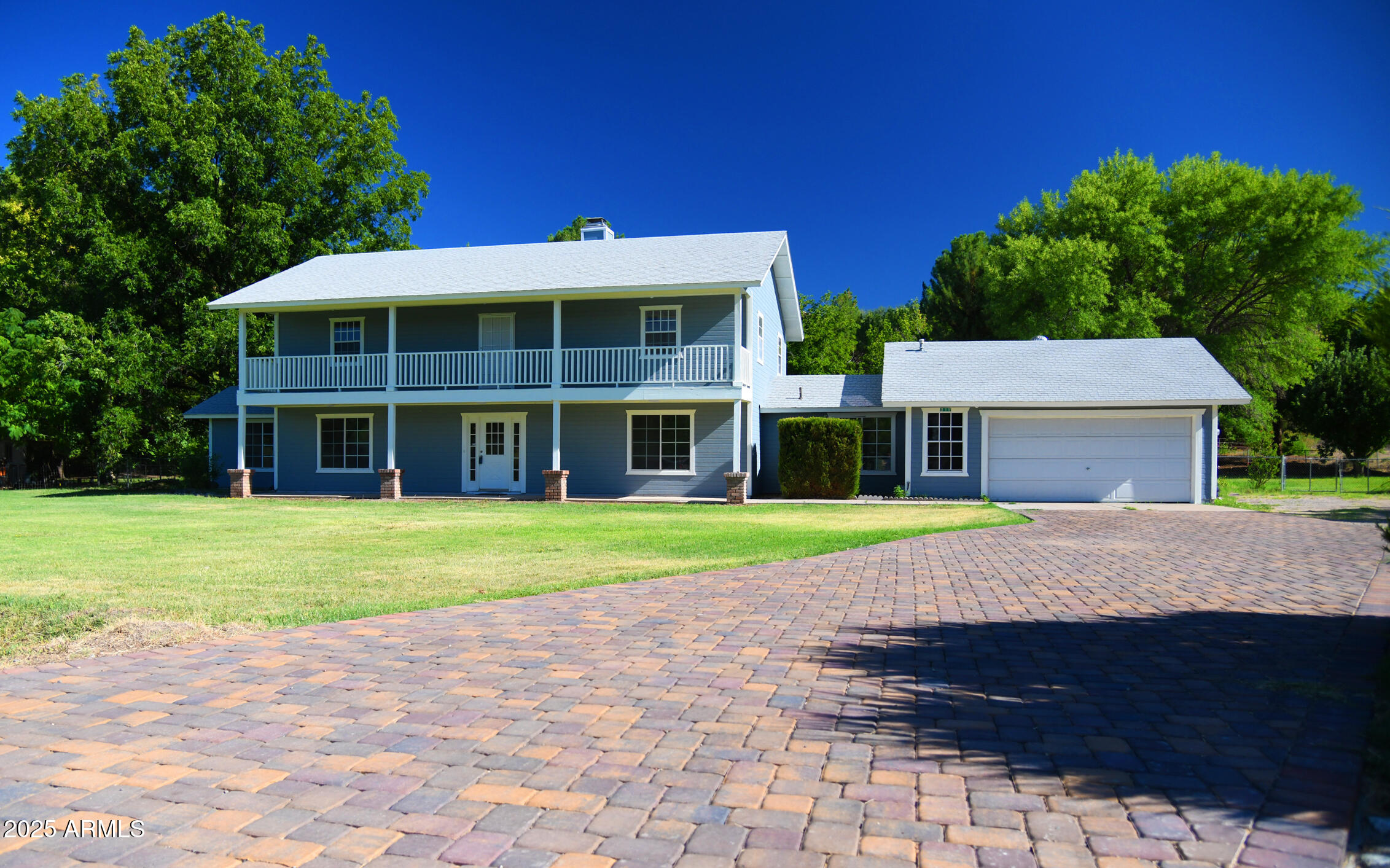 Welcome to the highly sought after Ranch Acres in Camp Verde! This gorgeous property is just waiting for you to make it your very own. Plenty of room for everyone with 5 bedrooms, 3 1/2 bathrooms and an office off of the primary suite with its own entrance from the backyard. Large laundry/mud room with powder bath off of the oversized two-car garage/workshop. So convenient! Enjoy your morning coffee in the breakfast nook or on the back patio and take in the fully irrigated, ample backyard. Natural gas for both your cooking enjoyment and living room fireplace for cozy nights. All of this and we haven't even gone upstairs yet! There you will find a split 4 bedroom layout with full baths on each side of the living room/loft. Make sure to experience the view from the balcony stretching the full length of the front of the home. It won't disappoint! Whether you're on the balcony watching the sunset or on the back patio gazing through the plentiful fruit trees at the sunrise, you will just fall in love with this property.