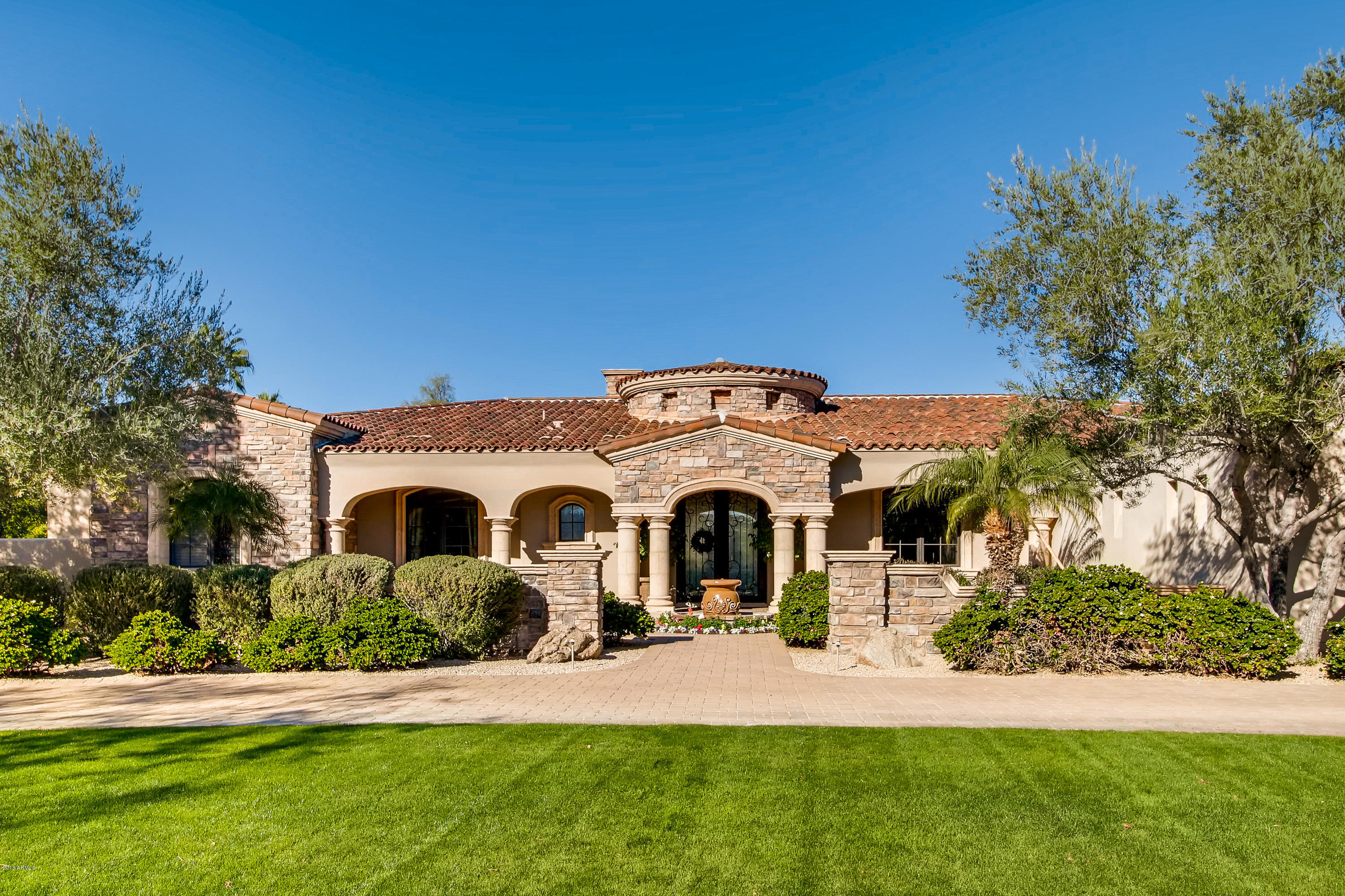 If you are looking for an enjoyable lifestyle, this is the home for  you.  Located in Paradise Valley, in the coveted  guard gated area of Judson, you will be close to great dining and shopping. Whether you are spending time with family or friends, there is a room for everyone's desires.  How about the large bonus room for games and movies; the master bedroom with workout room, steam shower, sitting area with fireplace; and a wonderful custom office.  Perhaps you would rather go outside to play ball or soccer, take a swim, or relax in one of the two under-covered patios.  This absolutely immaculate home is ready for its new owners.
Check out the  Photos + Aerial Tour!!