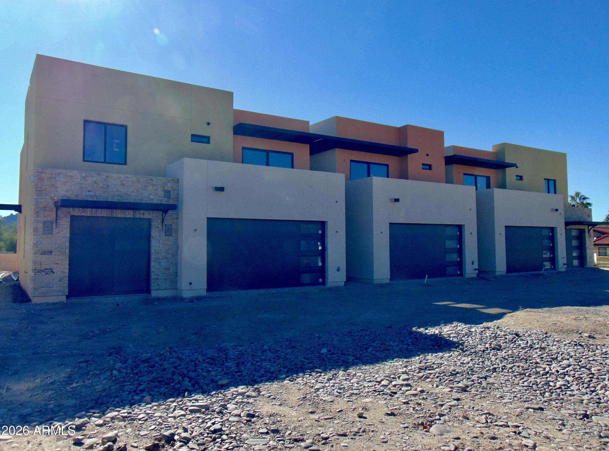 NEW CONSTRUCTION!! 5 UNIT ATTACHED  TOWNHOUSE COMPLEX IN FOUNTAIN HILLS! Estimated total completion date is June , with first units being 100% finished end of May. All units have 3 bedrooms, 2.5 baths, average 1875 sq ft, and have a 1 or 2 car garage. All 2 story units with outdoor patios and some have upstairs terraces. Main levels have an open floor plan kitchen and living room area with white soft close cabinets, quartz countertops, pantries, and stainless steel appliances. 3 large bedrooms, lots of storage space and in unit laundry rooms can all be found upstairs. Great, quiet neighborhood and only 1 mile from the Avenue of the Fountains, Fountain Park and the world Famous Fountain.