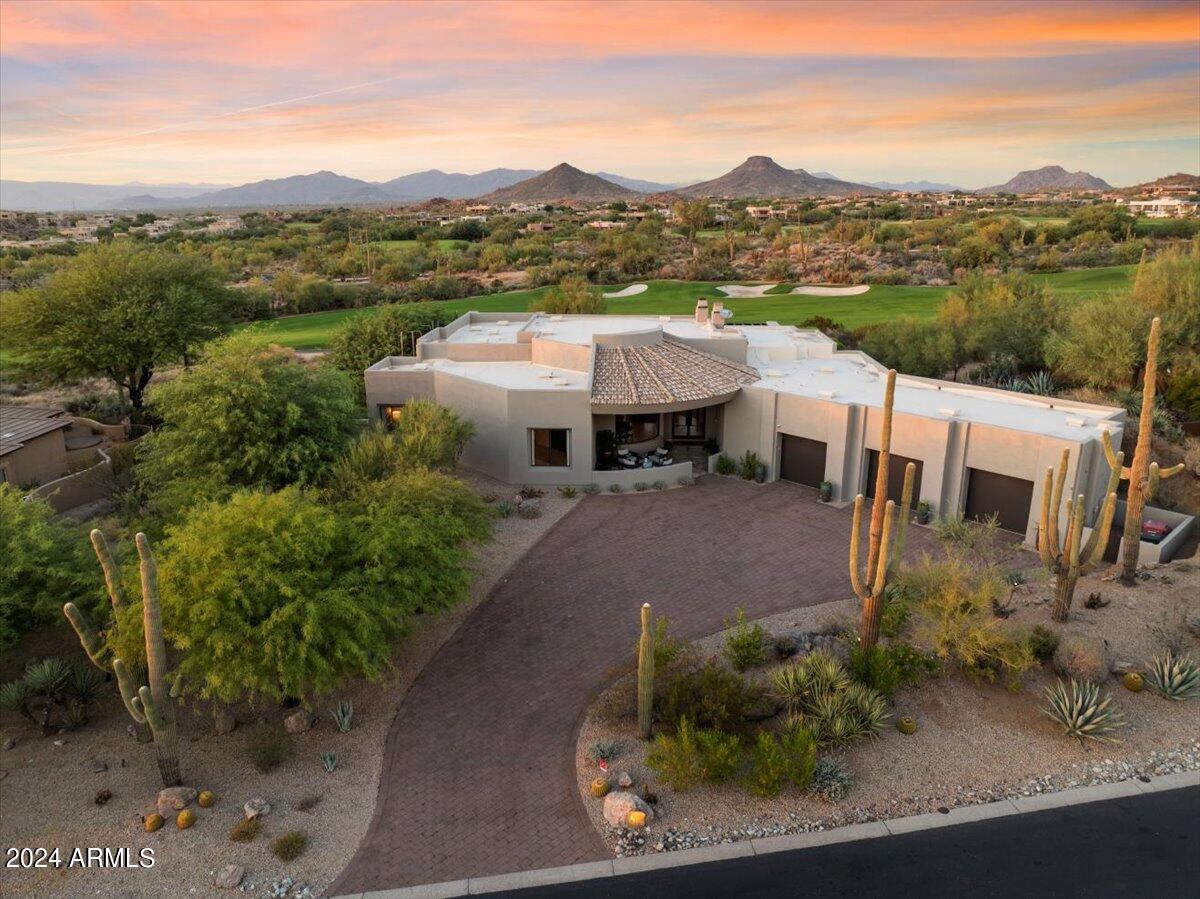 Best views in Troon North for under $3,000,000. This stunningly remodeled Golf Course view property in gated Pinnacle Canyon, Troon North, offers an unparalleled living experience. Situated on the 10th hole of the prestigious Monument Golf Course, the home enjoys lush green views framed by breathtaking natural landmarks such as Stonedge Boulders, Goldie Brown Butte, Cindercone Mountain, the Continental Mountains, and Skull Mesa to the north. City lights and sunsets to the west, coupled with a perfect view of Pinnacle Peak from the front entry, complete the picturesque setting.
Remodeled to perfection in 2022 by a renowned luxury builder, this home seamlessly blends modern elegance with functionality. The kitchen, a chef's dream, has been thoughtfully redesigned to optimize space.