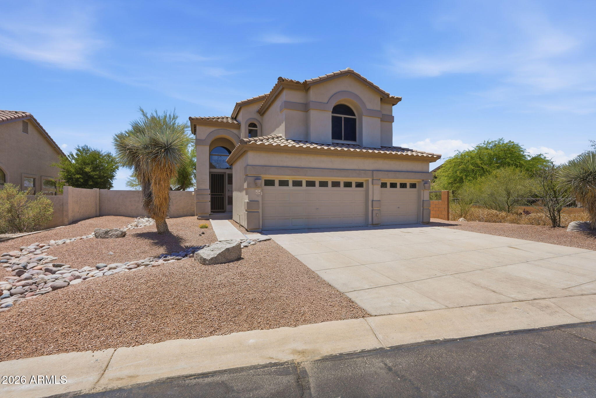 Come and see this stunningly remodeled 4-bedroom, 3-bathroom home with a 3-car garage and sparkling pool, ideally situated on a premium view lot in the highly sought-after Las Sendas community of Mesa. From the moment you arrive, you'll appreciate the exceptional curb appeal featuring a freshly painted exterior, low-maintenance landscaping, and a move-in ready presentation. Step inside to soaring ceilings, brand-new white oak flooring throughout the main level, and plush patterned carpet that extends up the staircase and throughout the second story. The inviting front living area is complemented by a custom built-in niche complete with a beverage refrigerator, creating the perfect space for entertaining guests. The heart of the home is the completely redesigned kitchen showcasing black shaker cabinetry, crisp white quartz countertops, a full-height custom tile backsplash, upgraded stainless steel appliances, a gas range, custom vent hood, built-in microwave, and oversized island. Just off the kitchen, you'll find an additional family room, a beautifully updated bathroom with a custom tiled shower, a downstairs bedroom ideal for guests or a home office, and a convenient laundry room.
Upstairs, the split floor plan provides privacy and functionality. The luxurious primary suite is tucked away at the rear of the home and features vaulted ceilings, a private walk-out balcony, and breathtaking panoramic city light views stretching from Phoenix to Tempe. The spa-inspired primary bathroom offers dual black shaker vanities with brushed gold hardware, a large custom tiled walk-in shower, separate soaking tub, private water closet, and a spacious walk-in closet with built-in cabinetry. Two additional bedrooms are located on the opposite side of the loft and share a beautifully remodeled Jack-and-Jill bathroom. Major system updates provide peace of mind, including two brand-new HVAC units, new roof underlayment, a rebuilt walk-out deck, and a new gas water heater. Additional upgrades include new shaker-style interior doors, updated hardware, window coverings, ceiling fans, plumbing fixtures, and designer lighting throughout, giving the home a fresh, modern aesthetic. Step outside to your private backyard retreat featuring a large covered patio, freshly installed artificial turf, and a sparkling pool with a new PebbleTec surface--perfect for enjoying Arizona's year-round sunshine and entertaining family and friends. Residents of Las Sendas enjoy access to an award-winning master-planned community offering miles of hiking and biking trails, parks, tennis and pickleball courts, community pools, fitness facilities, golf at the renowned Las Sendas Golf Club, and a vibrant calendar of community events. The home is located within the highly regarded Mesa Public Schools district, with nearby educational options including Las Sendas Elementary School, Fremont Junior High School, and Red Mountain High School. Convenient access to Loop 202, shopping, dining, recreation, and outdoor adventures make this exceptional property the perfect place to call home. Don't miss this rare opportunity to own a beautifully updated view home in one of Mesa's premier communities.