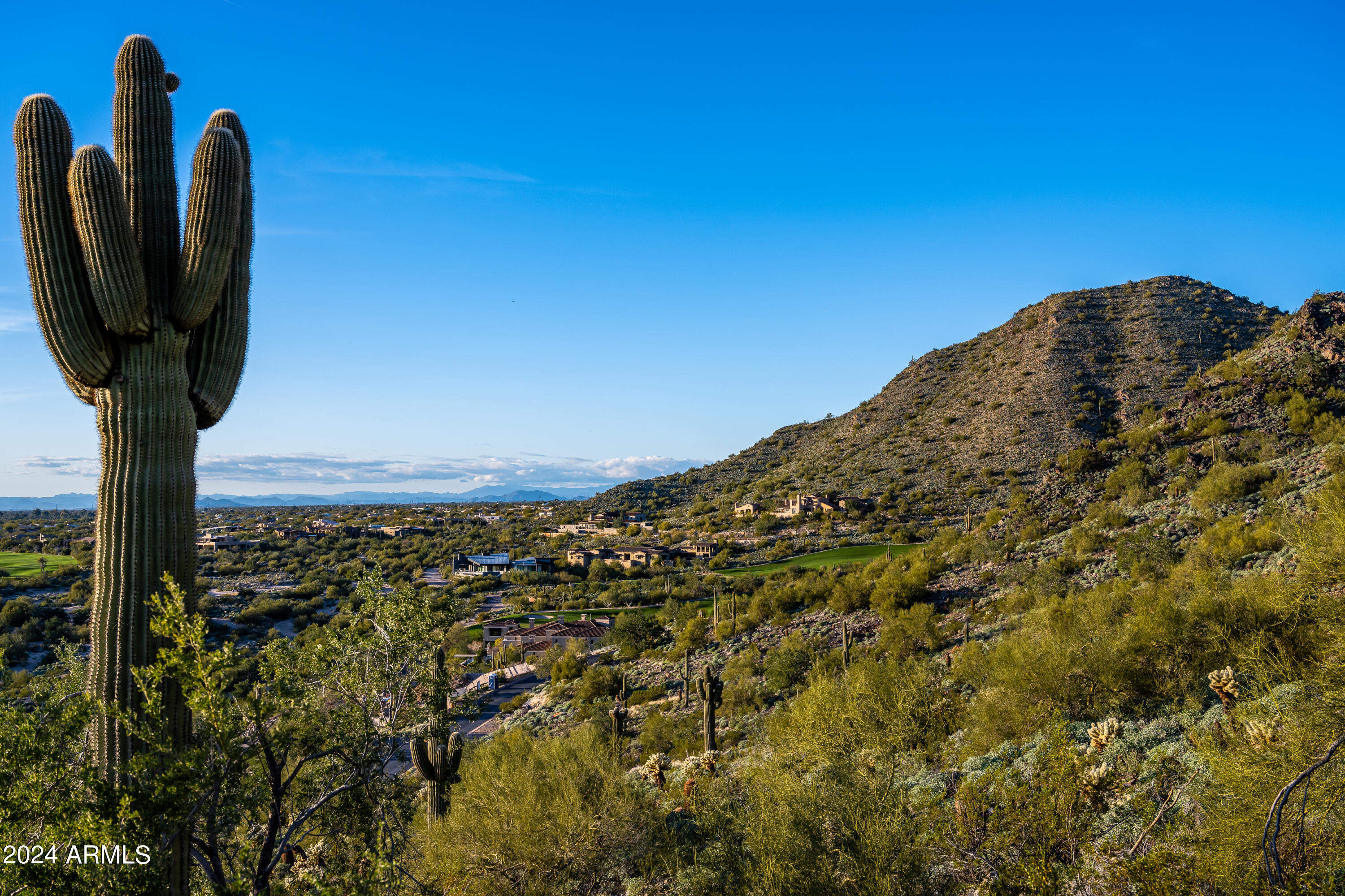 SILVERLEAF GOLF MEMBERSHIP OPPORTUNITY!  Panoramic sunset views and fully approved Modern Prairie Design! This premium view lot in the Upper Canyon of Silverleaf includes availability to a full golf membership, allowing a buyer to circumvent the lengthy waiting list and enjoy immediate access to one of the most celebrated clubs in the Southwest. With an elevated setting, this prime homesite captures sweeping city lights and mountain views with no obstructions. This property comes with fully approved plans crafted by renowned architect CP Drewett of Drewett Works for an awe-inspiring modern interpretation of a Prairie style desert estate.  This design is the result of a two-year creative collaboration, headed by Drewett and a hand selected team of consultants Cutting edge interior design has been developed by Claire Ownby, founder of Ownby Design. While the vision is a sophisticated custom estate, the functionality is comfortable and inviting. The unique design truly elevates the tenets of desert modernism and resort style living. Perched at the summit of a long private driveway and elevated over 50' above nearby homes, every area of this three-acre estate has spectacular views and are destinations within themselves. Discover the ultimate in luxury lifestyle at Silverleaf, one of Arizona's top addresses./ Silverleaf is known for its world class golf, clubhouse and spa, its inspiring timeless architecture, and its stunning location set against backdrop of the McDowell Mountains./ With guard-gated privacy and easy access to nearby hiking trails, restaurants and shopping, this mountain retreat is the perfect place to make your next home.  

Silverleaf, located in North Scottsdale, Arizona, is a prestigious guard gated community known for its luxurious estates, exclusive golf courses, private Club and stunning desert landscapes. The Tom Weiskopf-designed Silverleaf Golf Course is a highlight for golf enthusiasts. With a blend of Spanish and Mediterranean-inspired architecture, the community offers a high standard of living, including upscale amenities like spas, fine dining, and exclusive shopping. Residents enjoy a harmonious balance between modern luxury and the natural beauty of the desert environment, making Silverleaf a sought-after destination for those seeking an exceptional lifestyle in North Scottsdale.