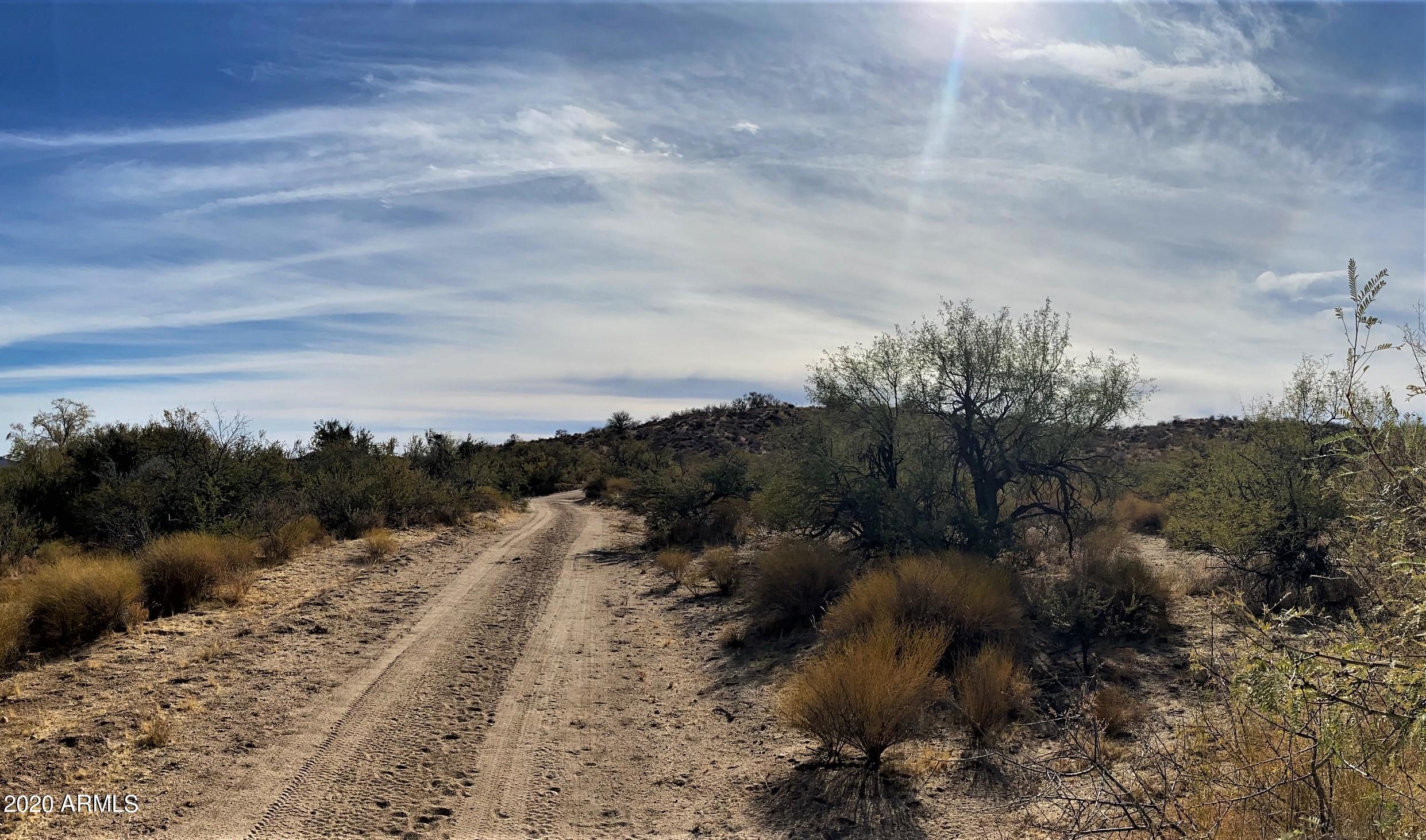 60 Acres to divide or keep whole!
Cowboy Country. Good water area. Power close.
Easy build property with high hill area that slopes down to Martinez wash. 
Good sandy ground ride down Martinez wash to Hassayampa wash to Rancho Rio. 
Survey was done.
Currently Ag statis with Yavapai Co.
Very low Ag taxes.