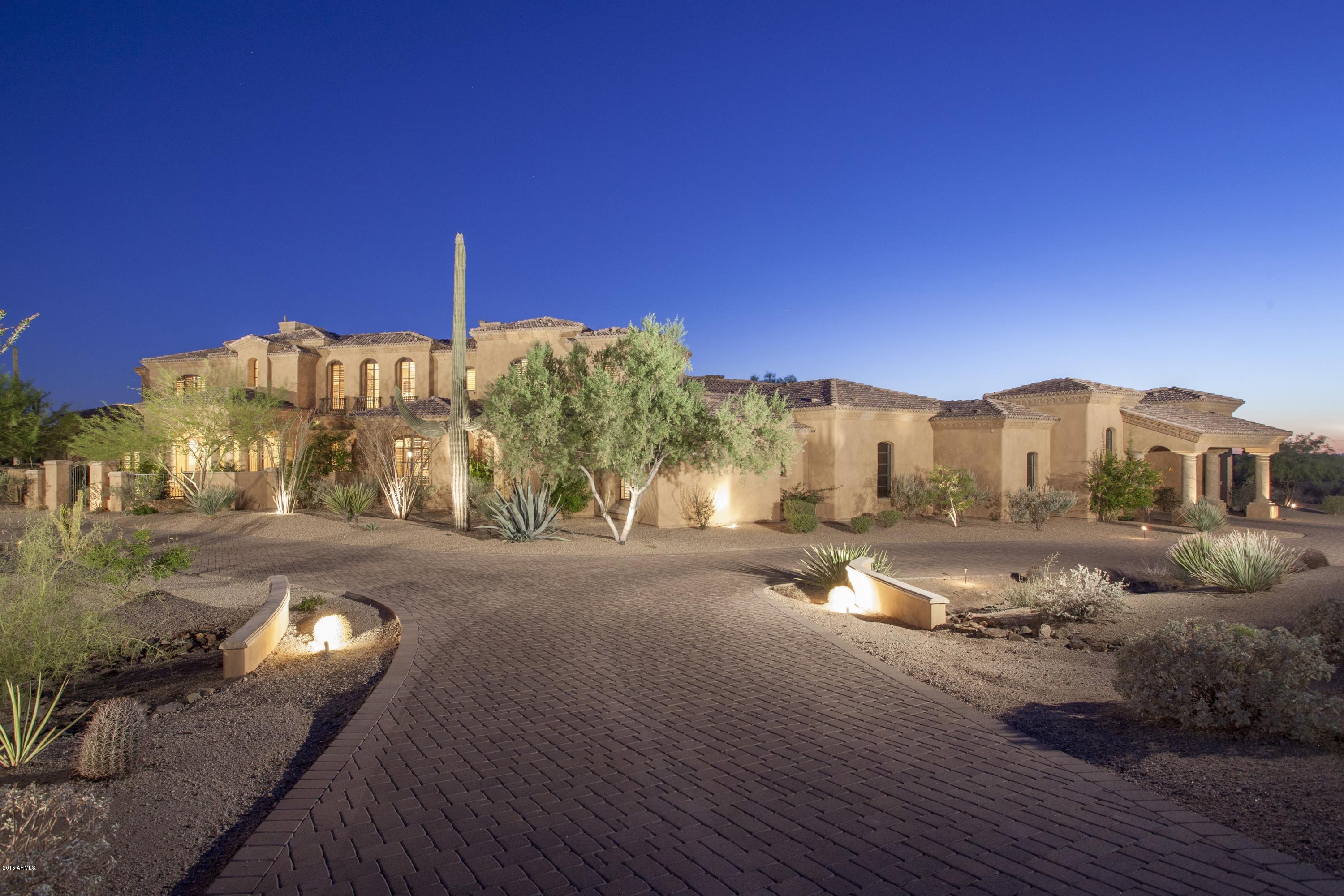 Escape from it all, yet be close to all conveniences from this private gated estate located on 4 acres in North Scottsdale. A well-constructed floor plan featuring a dramatic great room with telescoping doors opening to a covered patio large enough for outdoor living room, dining room, and kitchen! This patio looks out over a private resort backyard with pool, spa, green grass, and beautiful views. Inside, living is primarily on the first floor--except for an additional family room/theatre/office and junior master suite on the 2nd floor. Creature comforts throughout-wine cellar, enchanting dining room, gourmet kitchen, all ensuite bedrooms, outstanding master suite with two walk in closets and private laundry. Humongous 5-car garage with room for more. A retreat you have to see to believe.