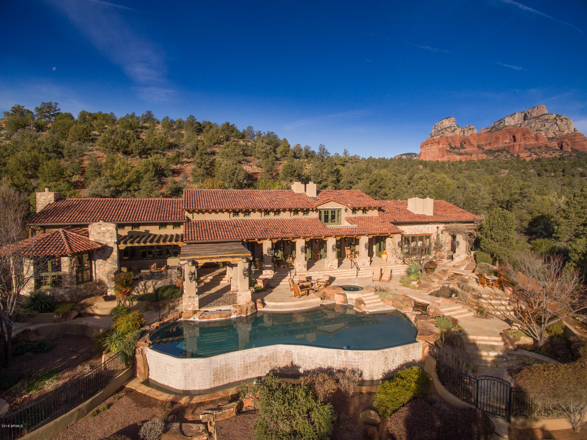 SANCTUARY in SOLITUDE!1st time available & BEST opportunity ever offered in Seven Canyons! Once featured in PHX Home & Garden magazine.Architectural influences of Mexican Ranch,Old Spain,& Native American cultures combine beautifully w/an open floor plan that exudes an Elegantly Rustic style for a buyer of discriminating tastes.Ineffable custom(Phil Morris-Builder/Robert Morris-architect)boasts 11 FP's,infinity-edge pool,2 spas,casita,2 firepits,outdoor living areas,expansive veranda,sweeping views of Red Rock cliffs,surrounded by Coconino Nat'l Forest.PLUS...adjoining lot is included w/this home!Tom Weiskopf designed golf course is a welcoming sight to entrance of this prestigious gated community.Come enjoy the unlimited amenities this home and Sedona has to offer!