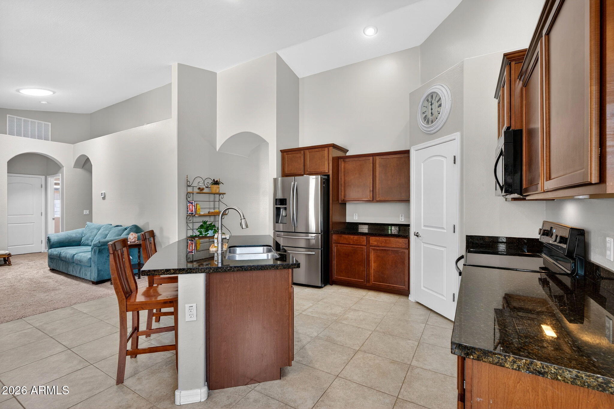 ALL SINGLE-STORY NEIGHBORS + 3-CAR GARAGE & RV GATE! 4BD/2BA, 2,027 SF on large .22 acre lot. Outside is where this home shines in value: w/ a utility door for direct backyard access, an RV gate opening to a large side yard ready for a trailer, boat, or weekend toys & an extended concrete slab that gives you flexible patio space. Vaulted ceilings open up the main living space. The kitchen is anchored by a generous walk-in pantry with an L-shaped layout that wraps from the kitchen around to the back, giving you serious storage that most homes in this price range cannot touch. Primary suite offers 2 walk-in closets! A spacious laundry room with built-in cabinets keeps everything organized & out of sight. Mature landscaping, established garden beds & lush green vegetation make the yard feel settled -- not new construction sterile. Quiet interior lot in the established Castlegate community off Ocotillo and Schnepf in the preferred 85140 zip -- minutes to Fry's Marketplace at Gantzel and Combs, Target, Sprouts, Banner Ironwood Medical Center, and the broader Gantzel-Ironwood retail corridor. Positioned just north of the approved San Tan Valley Urban Core, the future downtown San Tan Valley.