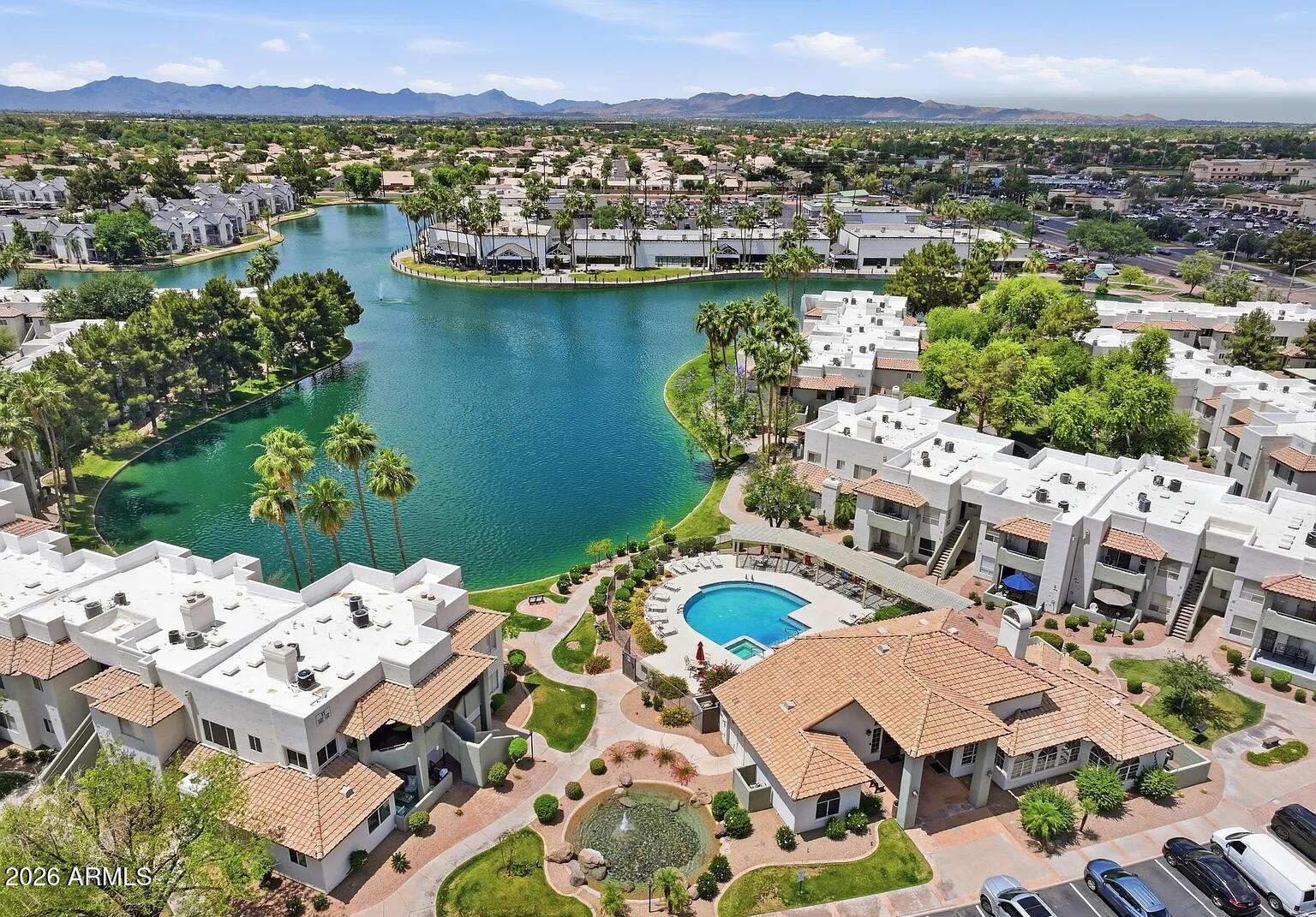 Back on the market due to buyer's inability to perform!  Now this beautiful 2-bedroom, 2-bath ground-level condo in the desirable Lakeshore at Anderson Springs community can be yours!. Enjoy resort-style amenities including 3 pools, 2 spas, tennis and pickleball courts, clubhouse, and fitness center. Lake and fountain views from the guest bedroom and kitchen. Open living and dining area leads to a spacious private patio with lush green views. Kitchen features granite countertops and stainless-steel appliances. Primary suite includes a walk-in closet and en-suite bath. Split floor plan offers privacy. Assigned covered parking nearby. Close to Sprouts, Whole Foods, Chandler Fashion Center, and easy access to Loop 101 & 202.