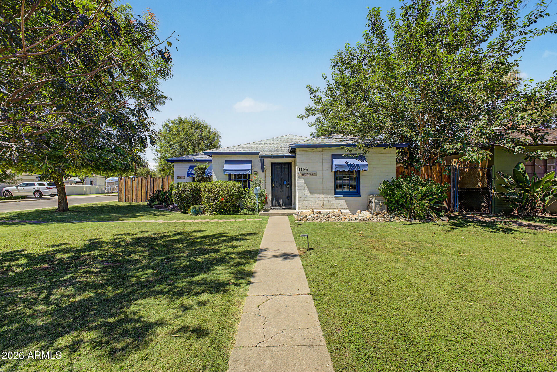 Rare opportunity in the highly sought-after Woodlea Historic District! This unique & CHARMING property features two separate homes on one lot, blending historic charm with modern convenience in one of Central Phoenix's most treasured neighborhoods. The main home is a 2 bedroom/2 bath, and the Cottage is a 1 bedroom 1 bath. The beautifully maintained main residence showcases timeless character, inviting living spaces, abundant natural light, and architectural details that reflect the neighborhood's rich history. A second detached residence offers exceptional flexibility for multigenerational living, guests, rental income, a private office, or creative studio space. Surrounded by mature landscaping and historic streetscapes, the property captures the essence of Woodlea living while providing the versatility today's buyer's market. Both homes offer comfortable living spaces, updated amenities, and a welcoming atmosphere that is difficult to find in newer construction. Located just minutes from downtown Phoenix, Midtown, the Melrose District, light rail access, dining, shopping, and entertainment, this property combines historic character with urban convenience. Whether you're seeking an owner-occupied income property, a multigenerational compound, or a unique historic residence with additional living quarters, this exceptional Woodlea offering presents endless possibilities. Experience the charm, character, and flexibility of owning two homes in one of Phoenix's most iconic historic neighborhoods.