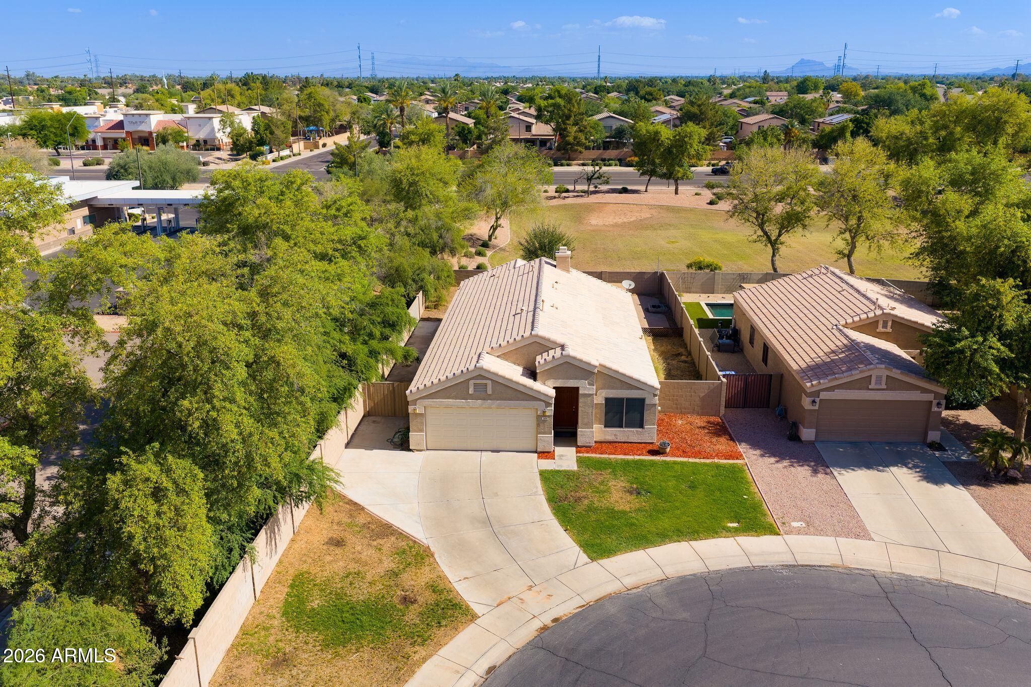 This four bedroom home is located on a large cul de sac lot, with a north / south exposure, plantation shutters throughout the home, granite countertops in the kitchen and both bathrooms, wonderful floor plan, spacious backyard, covered back patio & backs to a very large green belt.