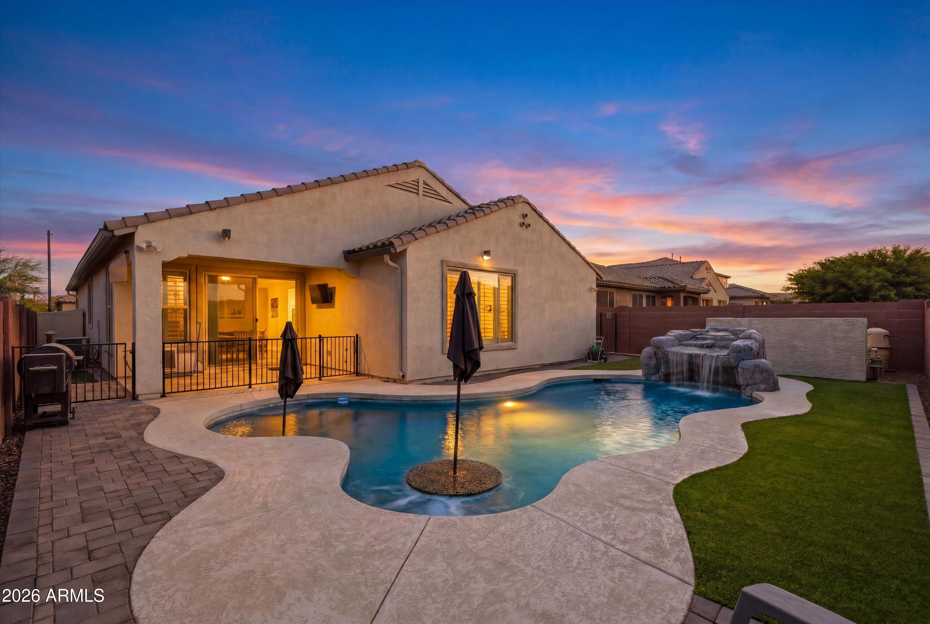Professional photography coming soon! Seller offering $10,000 in concessions with a full price offer! Highly updated Desert Oasis home featuring a fully owned, paid-off solar system (no lease or loan to assume) with critter guards for added protection. This move in ready home offers a gourmet kitchen with Cafe Series refrigerator included, fresh paint, upgraded baseboards, and a luxurious oversized walk in shower. Enjoy the backyard oasis with a PebbleTec saltwater pool, pool heater, water feature, and built-in seating. Additional upgrades include reverse osmosis with alkaline water, whole-home water softener, security cameras, 2 doggy doors, and an epoxy-coated insulated garage with mini-split HVAC. Flexible living space and enclosed office provide endless options. Washer/dryer included.