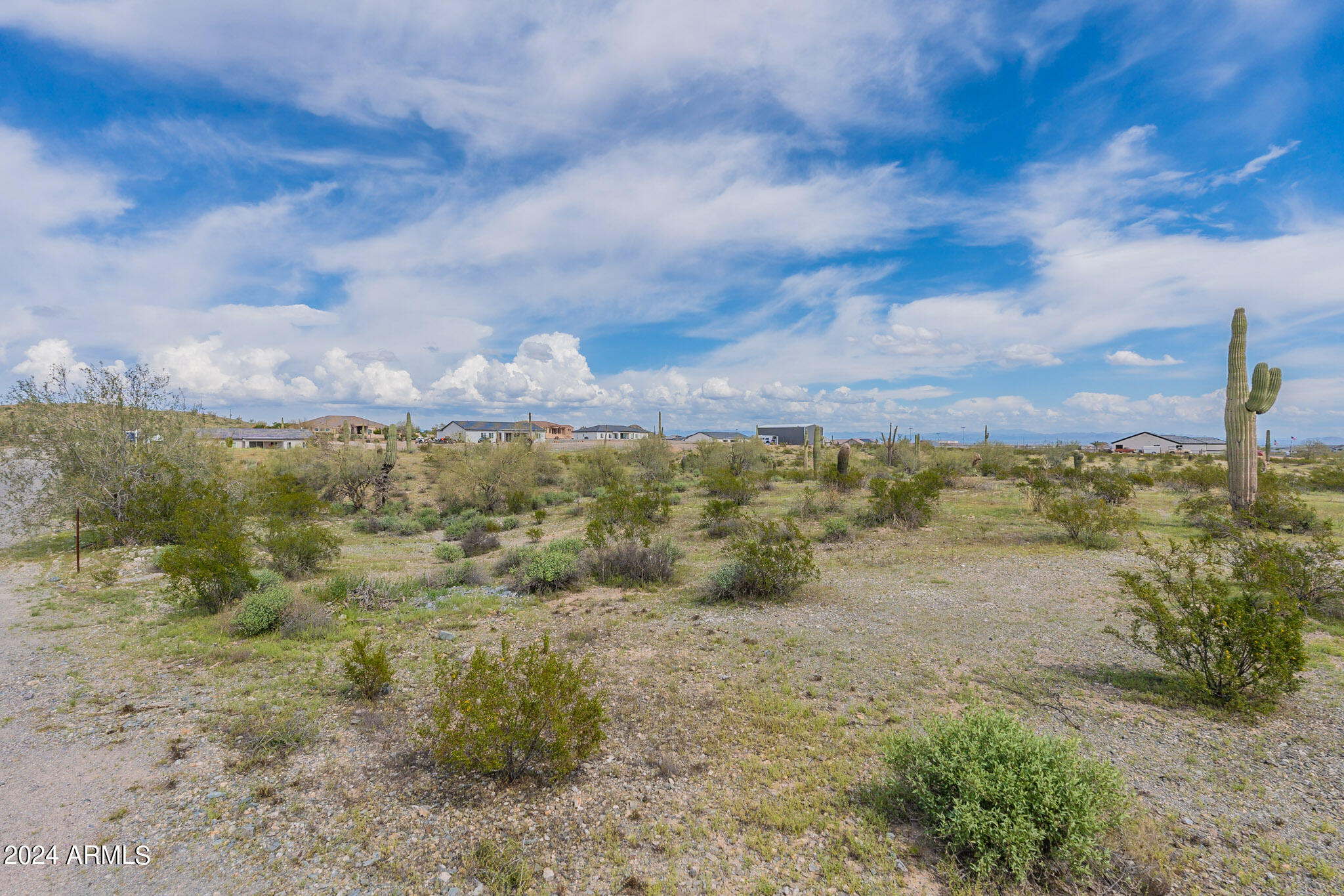 Seize the opportunity to create your dream home or invest in a multi-home project on this stunning 5.02-acre desert property in the San Tans. Nestled among custom and semi-custom homes, this prime location offers the perfect blend of natural beauty and modern convenience. A water agreement with Epcor is already in place and partially prepaid. Whether you choose to divide the land into multiple lots or design a private estate, you'll enjoy breathtaking sunsets and star-filled nights. Wake up to serene mountain views and explore nearby trails surrounded by native desert landscape.