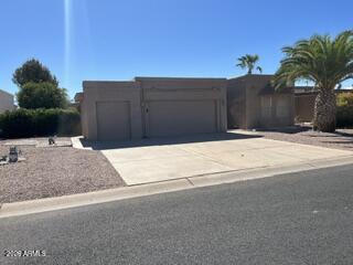 This well maintained Toltec Model offers 2  2 generously sized Master bedrooms w/skylights in each bath, L-shaped great room, cozy dinette, dedicated laundry w/storage. Enjoy the great outdoor living with a expanded wrap around patio, 
large yard with mature fruit trees, flower garden, low maintenance ground cover and the privacy of no
neighbors behind you. There is a 2-car garage w/storage plus a golf cart garage/workshop.  The roof has been recently repaired/recoated w/warranty. This Home is a MUST SEE! Don't let it pass you by.
