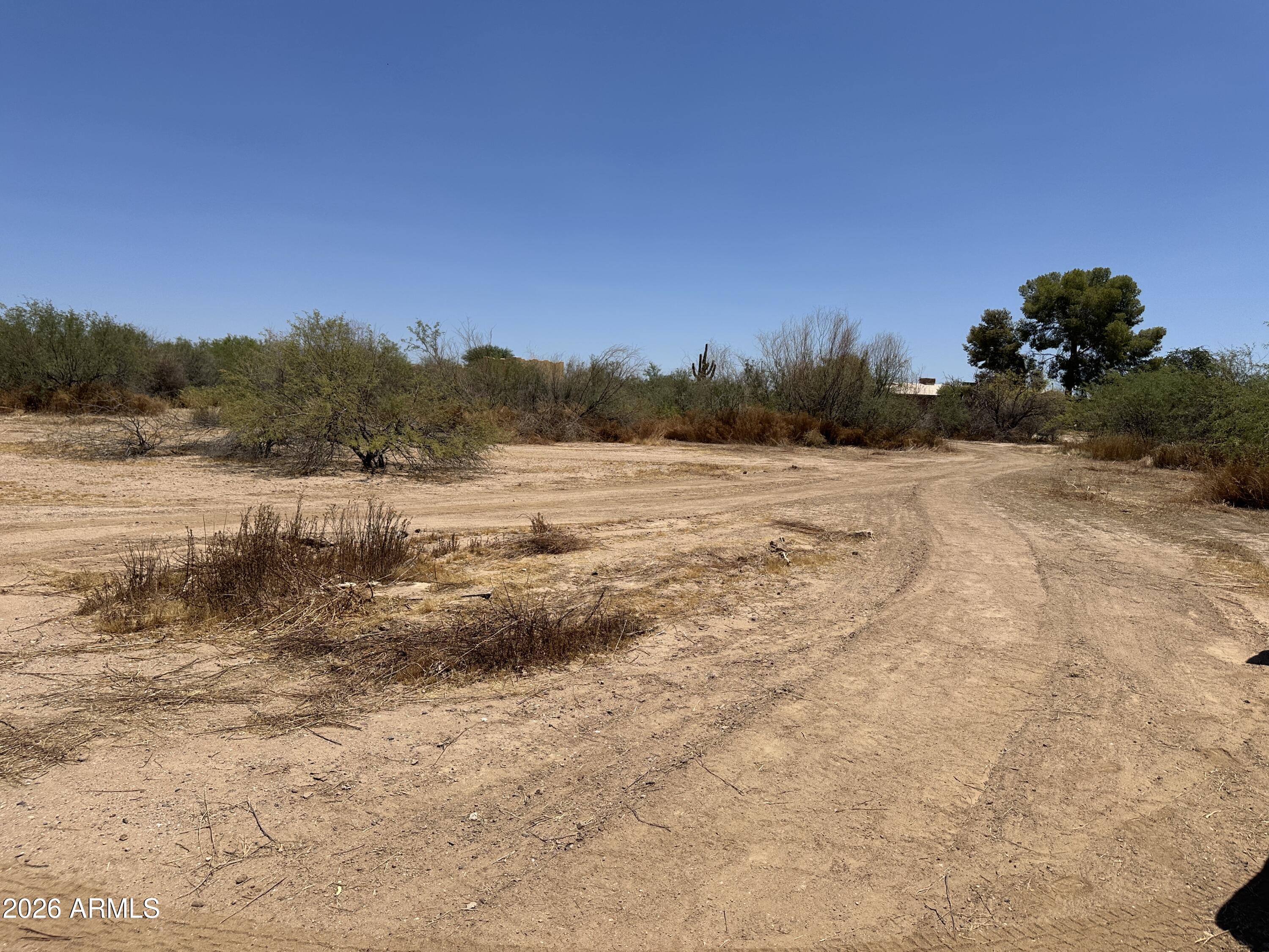 Discover the freedom of wide-open Arizona living with this beautiful vacant horse property. Offering expansive views, breathtaking sunsets, and plenty of room to build your custom home, barn and corrals, this property is ideal for horse enthusiasts and anyone seeking a peaceful rural lifestyle while still being conveniently located near local amenities