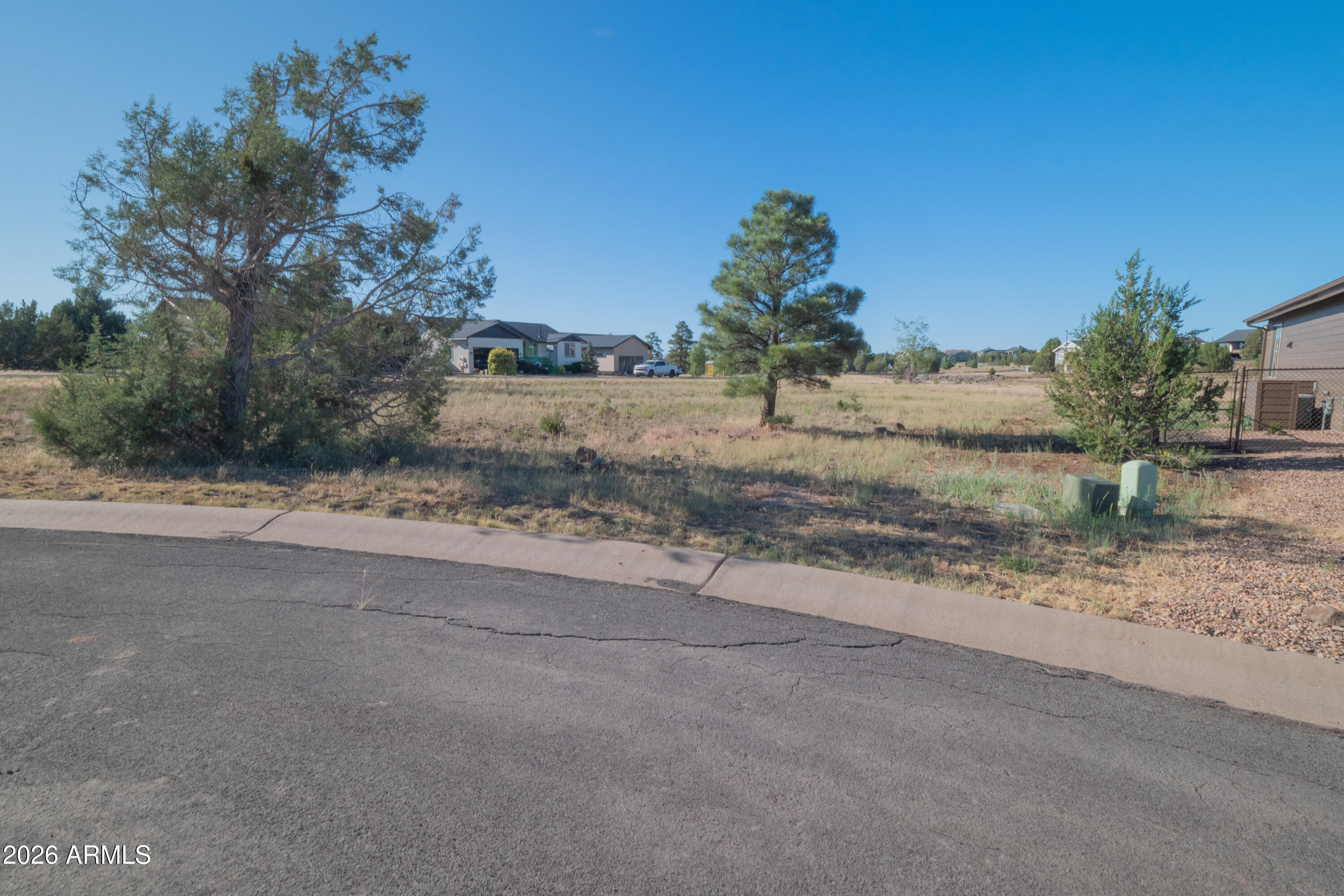 Beautiful Lot in Show Low Bluff. On the corner of a culdesac section of Lorenzo Sigreaves Dr. Behind the property is a common area for drainage, Lots will not back each other giving the feel of extra space.