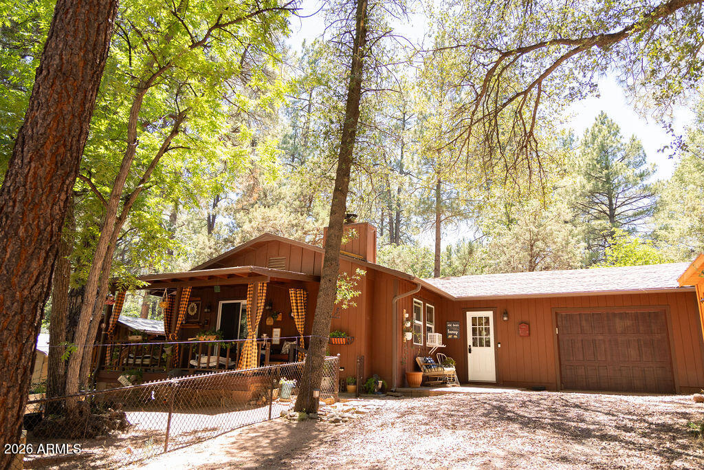 Beautifully updated and move-in ready, this charming home in Cool Pines offers comfort, style, and plenty of thoughtful upgrades. Enjoy relaxing on the spacious covered front porch overlooking the partially fenced yard and a versatile she-shed perfect for hobbies, a studio, or extra storage. An oversized one-car garage features attic storage, providing ample space for all your gear. Inside, you'll be welcomed by a convenient mudroom that leads into an open-concept living area designed for everyday living and entertaining. The updated kitchen showcases stainless steel appliances, abundant cabinetry, and a large breakfast bar that flows seamlessly into the great room, where a fireplace creates a warm and inviting focal point. The spacious primary bedroom includes more... a walk-in closet and stylish barn doors, while the second bedroom features a built-in Murphy bed, making it an ideal guest room or home office. The updated bathroom, newer windows, luxury vinyl plank flooring throughout, generous storage, and included washer and dryer add to the home's appeal. Situated on a private lot, this well-maintained property is ready for you to move in and start enjoying mountain living.