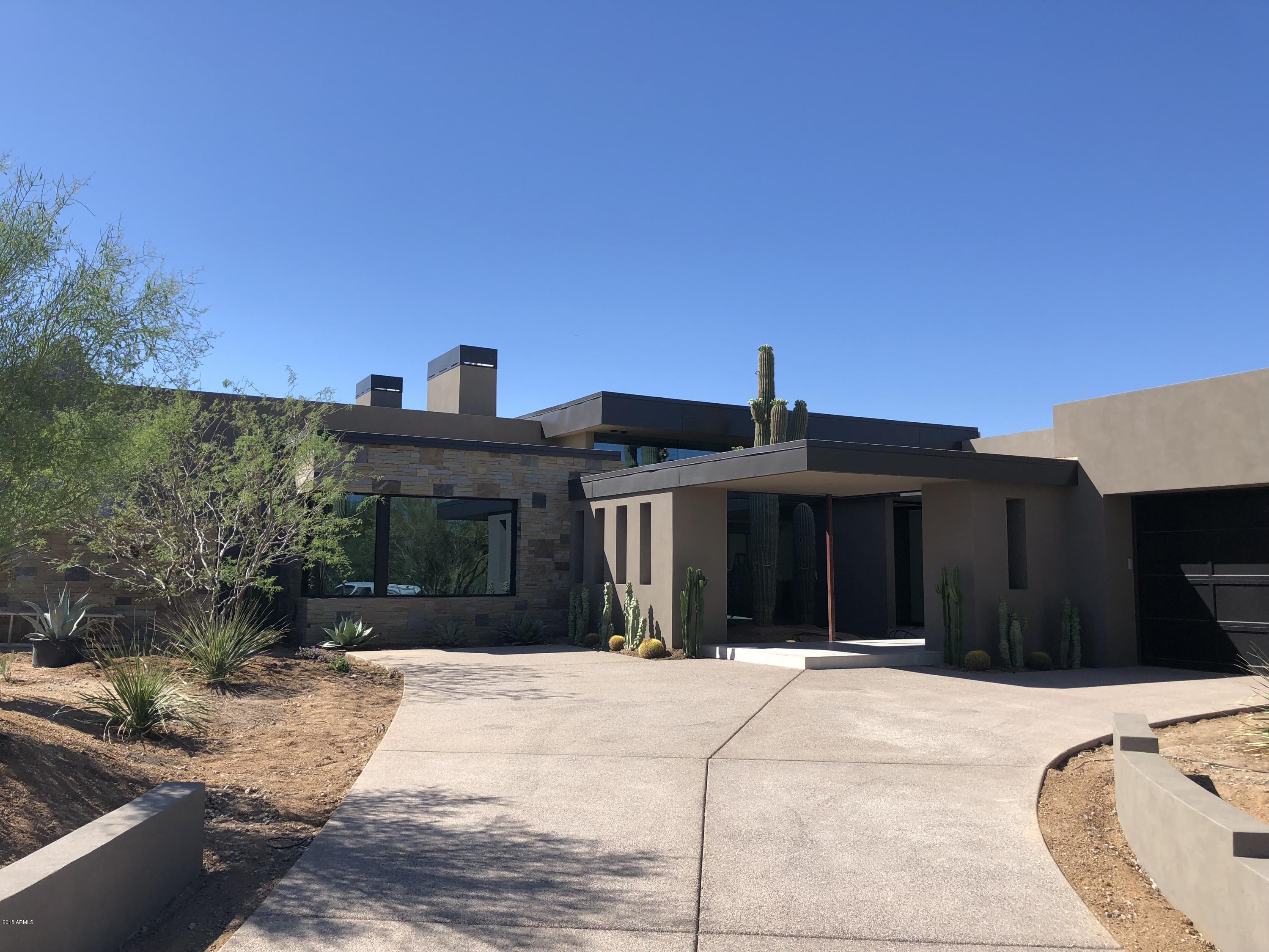 New construction by GEF Development and designed by Craig Wickersham within the guard-gated community of Estancia * Located on a private lot, this home boasts privacy and commanding views of Pinnacle Peak * Dynamic floor plan, exceptional finishes, all the right spaces and a true blend of indoor-outdoor living set this home apart *