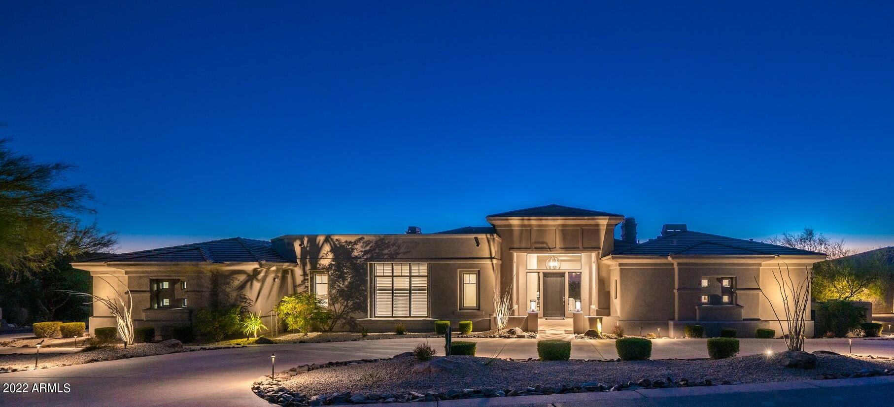 Within the highly sought-after neighborhood of The Retreat at One Hundred Hills comes this fully transformed estate. A 2019 renovation managed by Ricci Renovations; the home still has that brand-new feel due to seasonal owners having only lived there a total of 10 weeks since completion. Ideally situated on a corner lot, the property exudes elegance with its exterior color, fresh landscape & lighting. Upon entry, you're immediately in awe of the views and 14' ceilings in the spacious living/dining room. It features 24' x 10' glass sliding panels offering picturesque scenery of the spectacular pool with Camelback Mtn as the backdrop. Continue thru the desirable floorplan to find beautiful wood tile flooring & custom cabinetry throughout. The redesigned kitchen boasts double islands, quartz counter tops, a gorgeous glass/mosaic backsplash & a professional series appliance package. Bathroom designs are lavish including a floor to ceiling marble shower in the owner's suite. Other features include 3 gas fireplaces, LED & designer light fixtures, his/her wardrobe & water closets, terrific wet bar full of amenities, bonus/office space in owner's suite as well as oversized guest rooms & laundry. The backyard is immaculate and showcases a 40' infinity edge pool, spa, waterfall, secluded pergola w/ BBQ station & built-in seating. This home exemplifies transitional contemporary luxury at its finest. 
*Please see docs tab for complete list of renovations.