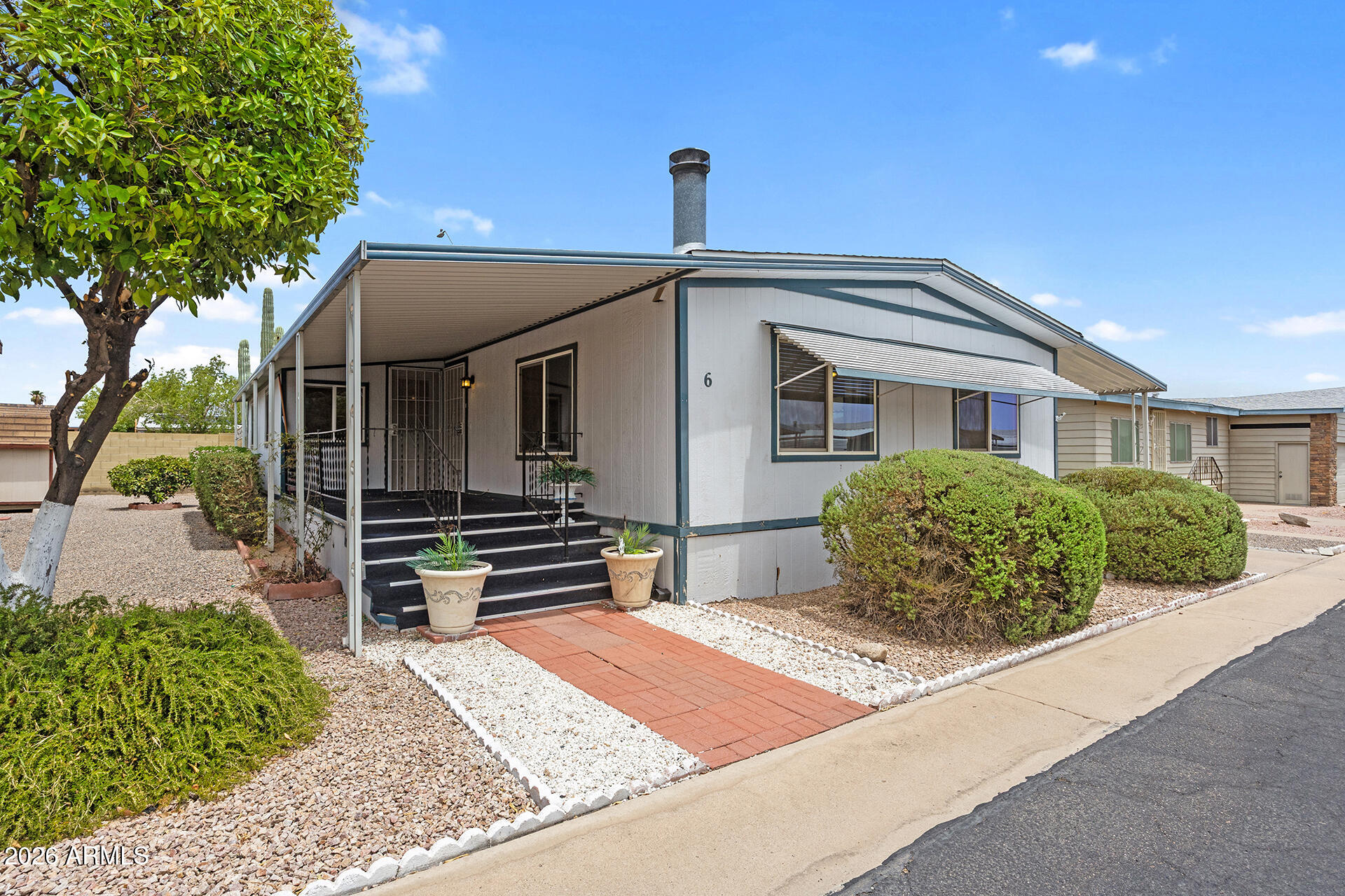 Affordable retirement living with exceptional updates and no HOA! This beautifully maintained 2-bedroom, 2-bath manufactured home with a versatile den is nestled in a serene adult community, offering comfort, value, and low-maintenance living. Recent improvements include a 120 sqft addition (2019), roof replacement (2021), water conditioner (2021), dual-pane windows (2018), Bosch dishwasher (2022), and garbage disposal (2022). Inside, enjoy the warmth of a cozy wood-burning fireplace, while outside you'll find two storage sheds with electricity, charming flagstone walkways, and mature orange trees that create a peaceful retreat. With no HOA and thoughtful upgrades throughout, this move-in-ready home offers an outstanding opportunity to enjoy retirement in comfort without sacrificing value.