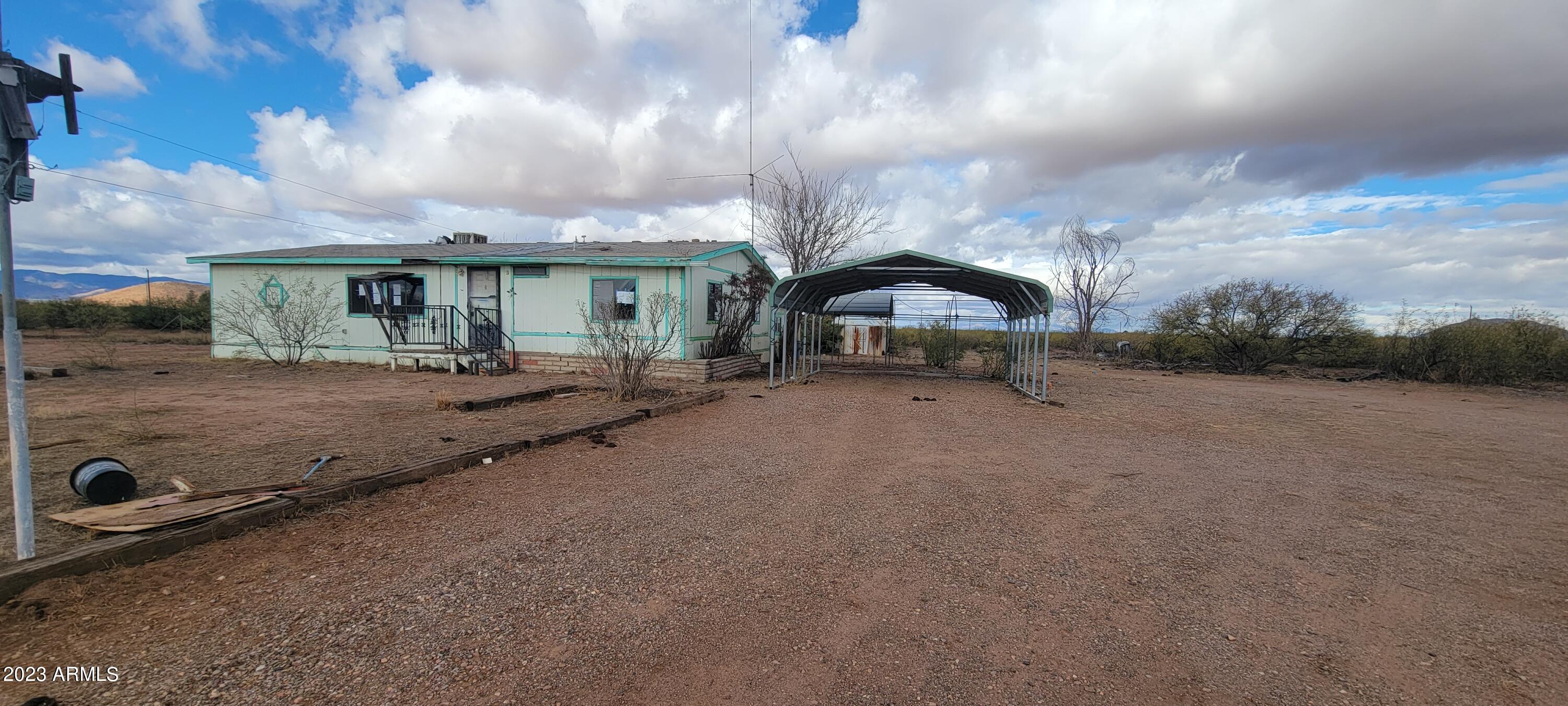 If you are looking for a reasonably priced home on acreage, look no further. This home sits on just over 10 level acres and there is a fenced area around the house and sheds. There is a 1/4 well share too. The home has a good floor plan and just needs some love. The views of the surrounding mountains are beautiful. Please be sure to close the gate when you leave this property to keep the cows out.