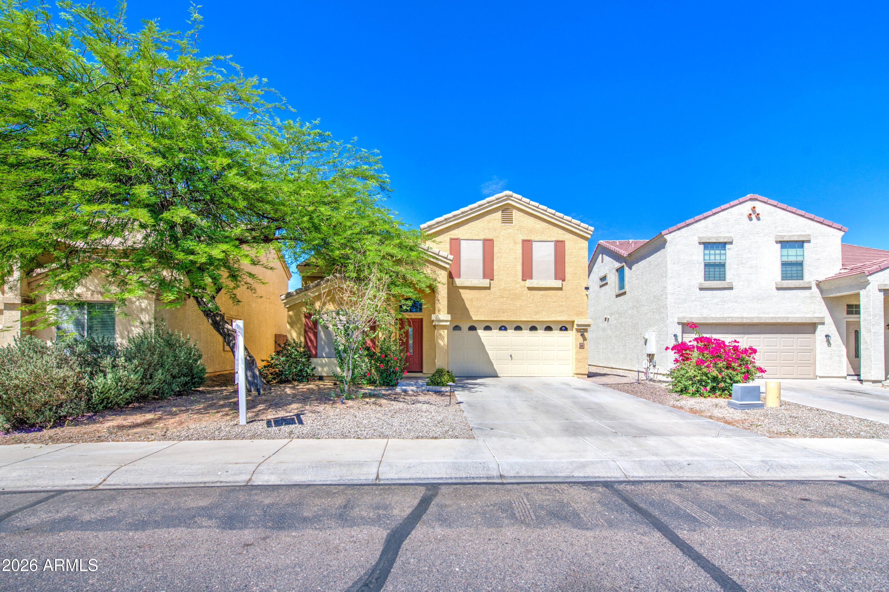 Welcome to this beautifully maintained 4-bedroom, 2.5-bath two-story home in Tolleson! This spacious home offers plenty of room for family and friends with an open and inviting layout. The kitchen features plenty of cupboard storage, a kitchen island, breakfast bar, dishwasher, and laminate countertops. Throughout the home you'll find ceramic tile, nicely kept clean carpet, fresh interior paint, and generous living spaces including both a family room and living room. spacious primary suite includes a full master bath with separate tub and shower, double sinks, and a walk-in closet. Step outside to enjoy the oversized backyard with plenty of room for entertaining, complete with pavers and an irrigation system. Recently painted exterior adds even more curb appeal to this move-in ready home