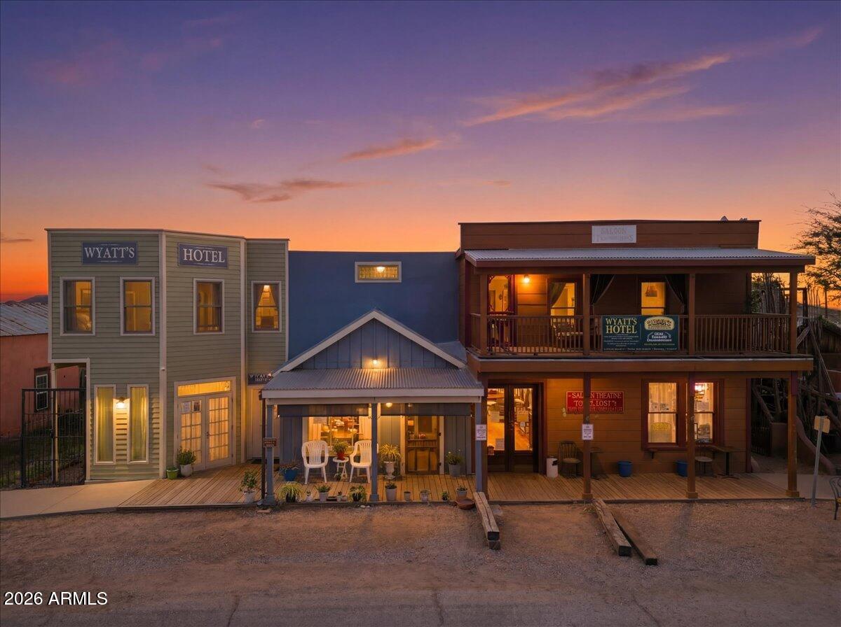 Steps away from Tombstones historic district & main street, Allen Street & the OK Corral. Currently operating as a hotel and theatre with wild west reenactments. Hotel: Upstairs 1 private apartment with bedroom, bathroom, living room, dining room,kitchen & private balcony. 3 guest suites w/ private bathroom, one with balcony views of the town. Plus a laundry room, storeroom & gathering space. Downstairs: 1 studio apartment with full bath and 1 apartment with kitchen, bedroom, living room, bathroom & storage. The theatre space is ideal for hosting events & gatherings with a separate entrance. Furnishings & decor included in the sale.