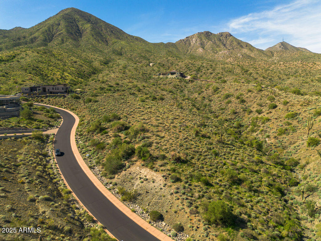 Elevated and extraordinary. This premier 1-acre homesite sits high within the guard-gated enclave of Eagles Nest in Fountain Hills, showcasing big-sky panoramas of the McDowell Mountain Regional Park, Red Mountain and endless Sonoran desert.  The elevated building envelope offers rare design flexibility while maximizing sunrise-to-sunset views and sparkling evening lights. Bring your architect and vision- this is the canvas for a signature desert estate.