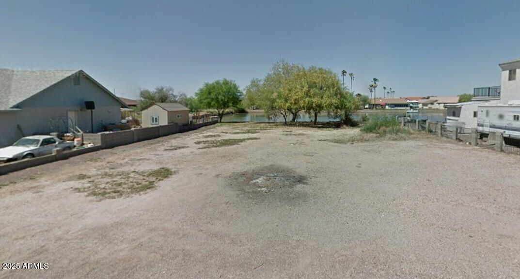 Large lot on Paradise Lake in Arizona City. This lot is ready for your new home!