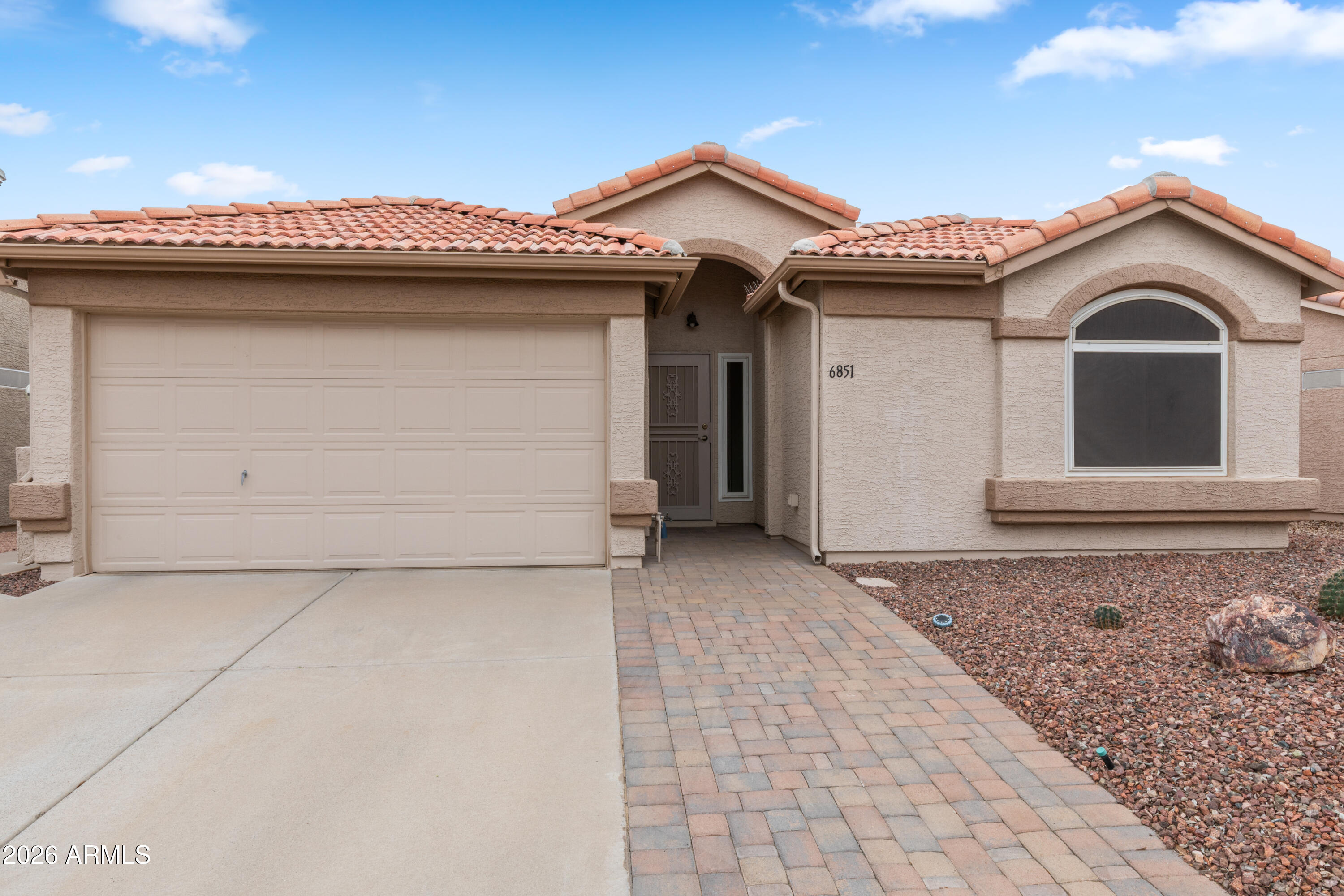 Welcome home to this beautifully maintained 2BR/2BA Santa Barbara model in the 55+ Sunbird Golf Resort Community. Enjoy low-maintenance living with front entry pavers, all-tile flooring, vaulted ceilings, and recessed lighting in the living room. Kitchen features Quartz countertops, added cabinetry with slide-outs, and newer stainless steel appliances, including a French-door refrigerator with ice maker. Home upgrades include Anderson windows, a sliding glass door with pet screen, and room-darkening cellular UV shades.Both bathrooms have been refreshed. The screened-in Aluma-wood patio with pavers and sunshades creates a private outdoor retreat. Major improvements include a 2020 roof with gutters and pigeon guards, and seller will pay off current solar lease at closing. Sunbird amenities restaurant & spirits, on-site post office, pickleball, tennis, shuffleboard, bocce ball, and too many activities to list!