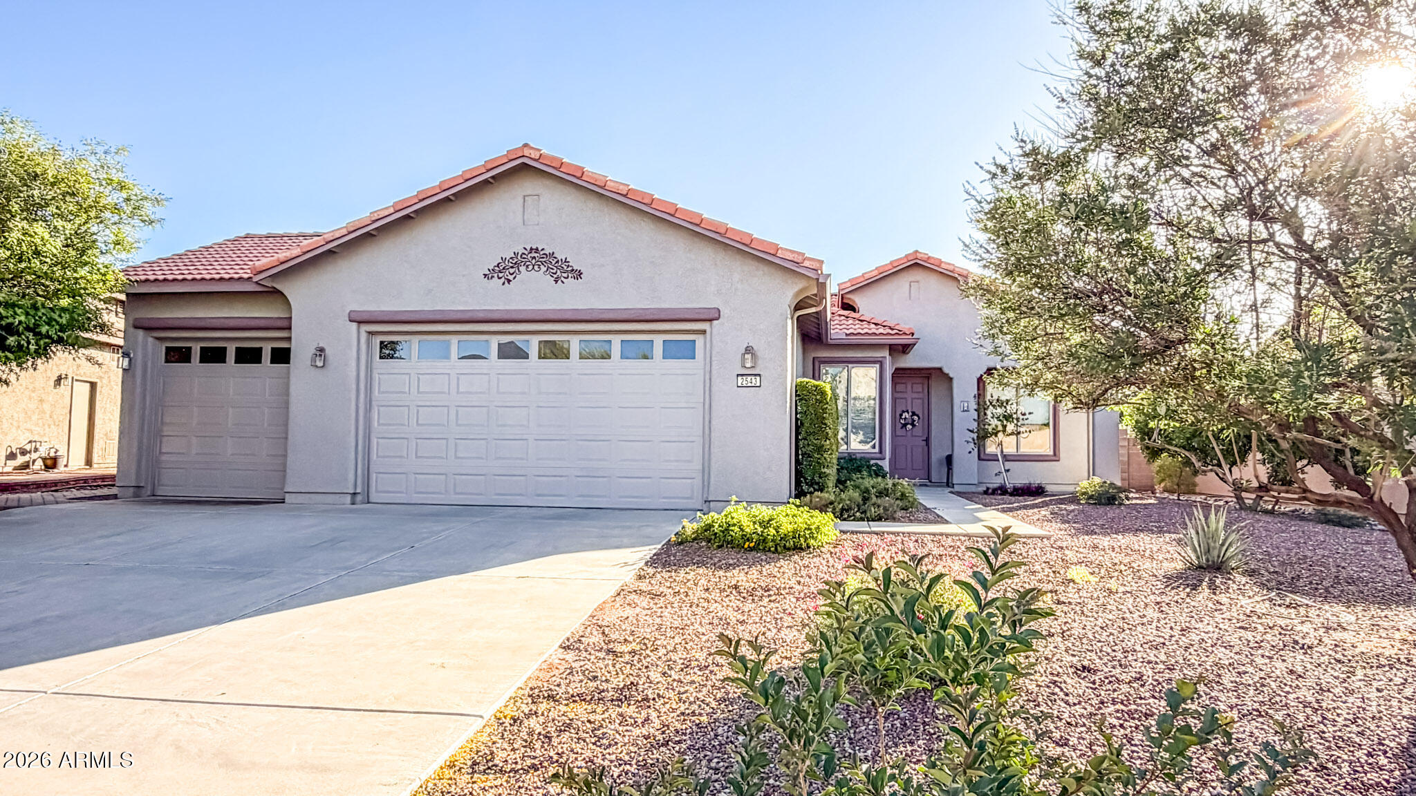 THIS IS IT! Beautiful 3-bedroom + den home offering 1,705 sq ft in the highly desirable Coronado Crossings subdivision, conveniently located near the South Garden Linear Park. Step inside to a bright, open great room floor plan featuring a cozy corner gas fireplace--perfect for relaxing or entertaining. The spacious kitchen is both functional and inviting, showcasing gorgeous light cabinetry, abundant storage, newer stainless steel appliances, and a center island with a breakfast bar. The generously sized primary suite is a true retreat, complete with an oversized walk-in closet and a luxurious en-suite bath featuring a large soaking tub. Additional highlights include a soft water system and an oversized lot designed for enjoying the Arizona lifestyle. The backyard features garden areas with water access, a greenhouse, a tool shed, and an extra-large covered patio--ideal for taking in our amazing year-round weather. This home is a must-see!