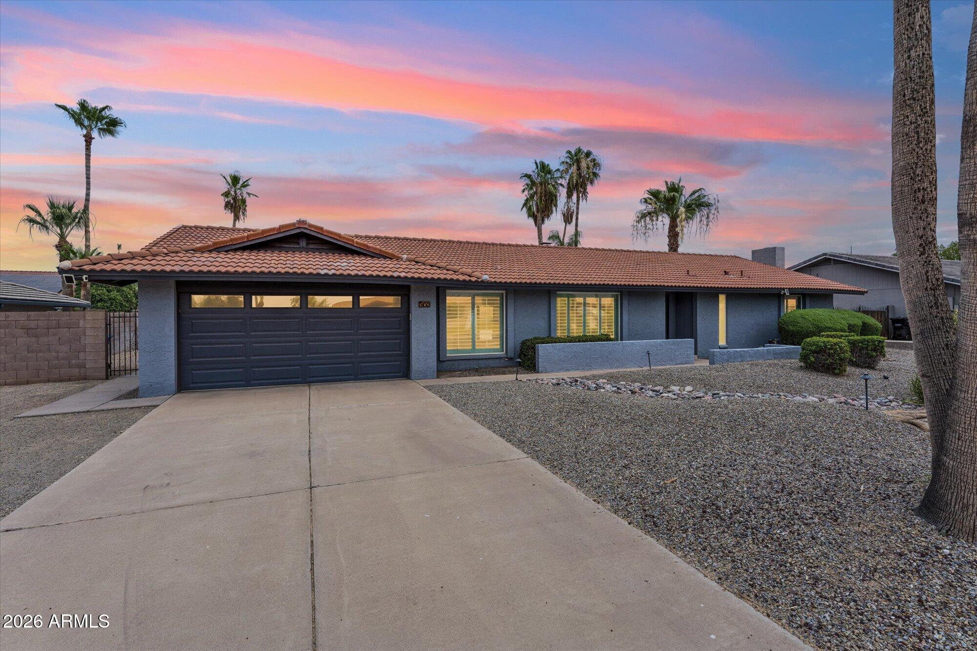 Designed for gathering and everyday living, this beautifully reimagined single-level home offers an expansive open layout with vaulted beamed ceilings, abundant natural light, and spaces that feel both inviting and functional. The remodeled kitchen anchors the home with timeless finishes, quartz countertops, white shaker cabinetry, stainless steel appliances. A dedicated game room adds flexibility for entertaining, while the spacious primary suite provides direct backyard access and a beautifully updated bath. Outside, the oversized backyard is a destination of its own with a sparkling pool, lush lawn, putting green, covered patio, and mature landscaping offering room to play, relax, and entertain year-round. Conveniently located near shopping, dining, parks, and freeway access.
