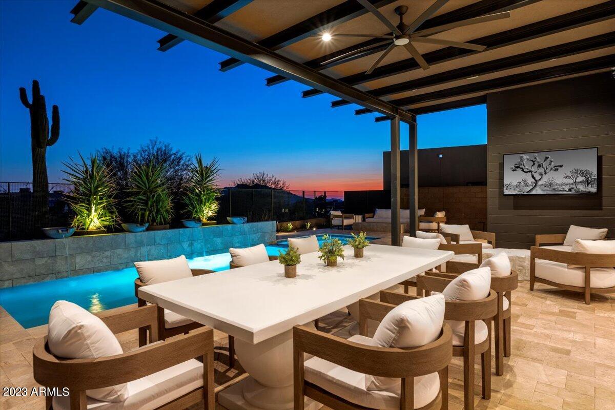Beautifully appointed, barely-lived-in Camelot Villa overlooking Desert Mountain's Seven Golf Course with views of Black Mountain down the 12th fairway. This single level home has 3 ensuite bedrooms, 3.5 bathrooms, a tandem 3-car garage, and striking interior finishes including stunning light fixtures and custom draperies. The bright and open great room, anchored by a sleek modern kitchen with top of the line appliances and a generous waterfall island, overlooks the sunny, south-facing backyard through 10' tall sliding glass pocket doors. Days away from completion, the backyard includes a brand new pool, spa, firepit, and built-in BBQ. A FULL GOLF MEMBERSHIP is available to the buyer upon approval. Professionally curated furnishings and accessories are available by separate bill of sale.