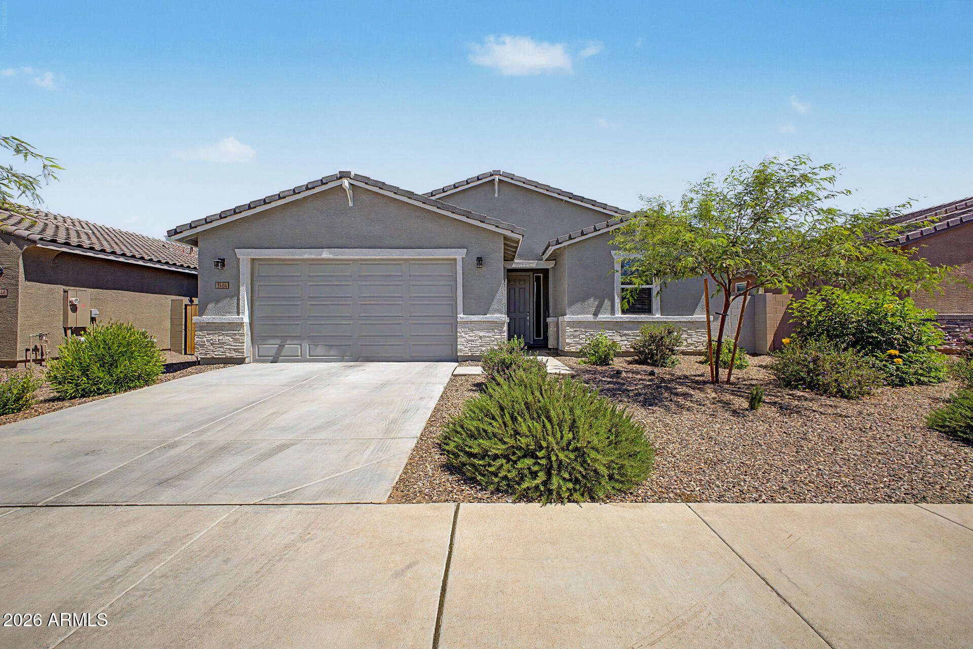 Welcome to this nearly new Meritage home, less than two years old, located in the sought-after gated community of Bella Vista Trails in San Tan Valley. This ENERGY STAR® certified home offers modern comfort, thoughtful upgrades, and energy-efficient features designed to help provide savings, healthier living, real comfort, and peace of mind.
Step inside to an open, light-filled floor plan with tile throughout--no carpet anywhere. The spacious kitchen is ideal for both everyday living and entertaining, featuring white cabinetry with hardware, designer granite countertops, an expansive island, LED disc lighting, a natural gas range, and plenty of room to gather.

The split floor plan offers privacy, with a relaxing primary suite featuring an updated shower with frameless glass, CLICK MORE a new deep soak tub, and a generous walk-in closet. Additional features include 8-foot raised panel doors, USB outlets, fresh interior eggshell paint, a tankless water heater, spray foam insulation, and an ANSI/ASHRAE 62.2 fresh-air management system.

The 2.5-car garage includes a tandem area perfect for a workspace, gym, or extra storage, along with epoxy flooring. The home also offers a 4-foot side yard gate, electric washer hookup, gas dryer hookup, and the added confidence of a 10-year structural warranty, plus remaining coverage under the 2-year functional major mechanical warranty for HVAC, plumbing, and electrical.

Enjoy resort-style living in Bella Vista Trails, a premier gated community featuring an amenity center, community pool, parks, sport court, and cornhole areas. With modern finishes, energy-efficient construction, and access to outstanding community amenities, this home is move-in ready and designed for today's lifestyle.