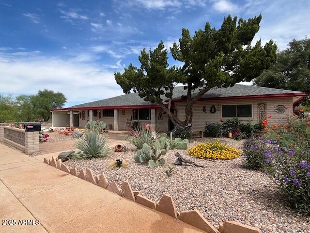 Experience Desert Living at it's FINEST in this 2950 sq ft single-level Ranch home perfectly situated on a large third-acre lot. Thoughtfully designed for both family living and entertaining, this residence offers versatility, comfort & style in every corner.  This home features 4 bedrooms 2 of which are Master Suites. There is also a full guest bath adjacent to the living and dining rooms. A Great Room with a cozy fireplace is attached to the spacious kitchen with granite countertops, soft-close cabinetry and a center island which provides additional seating as does the bistro table. The East wing features 3 bedrooms, one of which is a master suite.  All bedrooms in this area boast large walk-in closets, and carpeting. This is a perfect configuration for multi-generational households. Next, experience the spectacular Arizona Room - perfect for year-round enjoyment! The Arizona Room  leads you directly to the backyard oasis. The easy-care desert landscaping in the front and back yards is designed to maximize your leisure time! Enjoy the large in-ground pool in the fully fenced and very private backyard. A robotic cleaner makes upkeep a breeze and if you don't want to use the solar cover this pool is also solar-heat ready.  For those crisp Arizona evenings don't forget to take a soak in the covered spa.  The home also features Premium Pergo Lifestyle plank flooring & Low-E vinyl windows for energy efficiency and natural light control. The covered two-car carport and expansive graveled RV parking area is another plus to owning this home. NO HOA! For peace of mind this home comes with a fully paid one year home warranty.  This is a rare opportunity to own a home of this size in an established community. Discover how to own this exceptional home before it is gone!