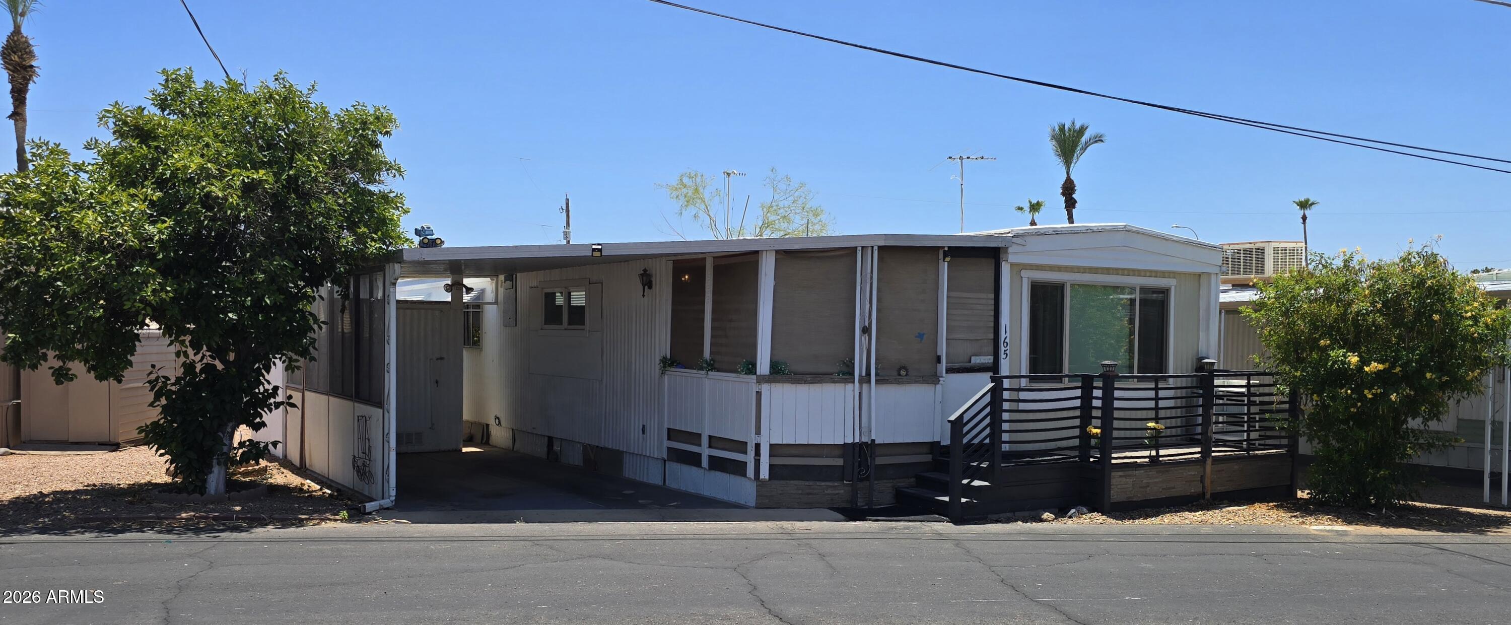 Welcome to 5933 E Main St #165 in Mesa, AZ! This charming 2-bedroom, 1.5-bath home offers comfortable living in a desirable East Mesa location. The functional floor plan features a spacious living area filled with natural light, a well-appointed kitchen with ample storage, and a dining space ideal for everyday living. The primary bedroom provides a peaceful retreat, while the second bedroom is perfect for guests, a home office, or hobbies. A full bathroom plus a convenient half bath add everyday practicality. Enjoy low-maintenance living with outdoor space for relaxing and easy access to nearby shopping, dining, golf courses, parks, and major transportation routes. A wonderful opportunity to enjoy all that Mesa has to offer.