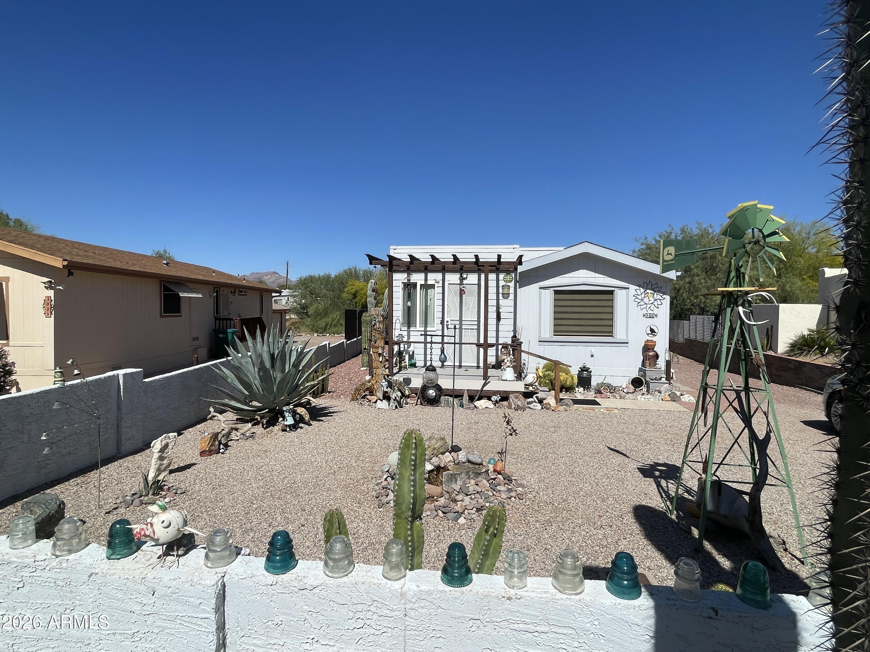 Give this charming, furnished 2-bedroom, 1-bath home a closer look! Inside, you'll find a thoughtfully maintained interior featuring vaulted ceilings, tile flooring and stylish travertine kitchen countertops. Major systems--including the appliances, hot water heater, A/C, and furnace--are all less than four years old, offering peace of mind and efficiency. Newer blinds add a fresh, modern touch.
Step outside to enjoy the landscaped backyard, complete with durable Trex decking and a covered patio--perfect for relaxing or entertaining year-round.
As an added bonus, the oversized garage easily accommodates two vehicles, providing ample storage and convenience.
This community has no HOA, a public golf course, and is surrounded by State and National Forest land.